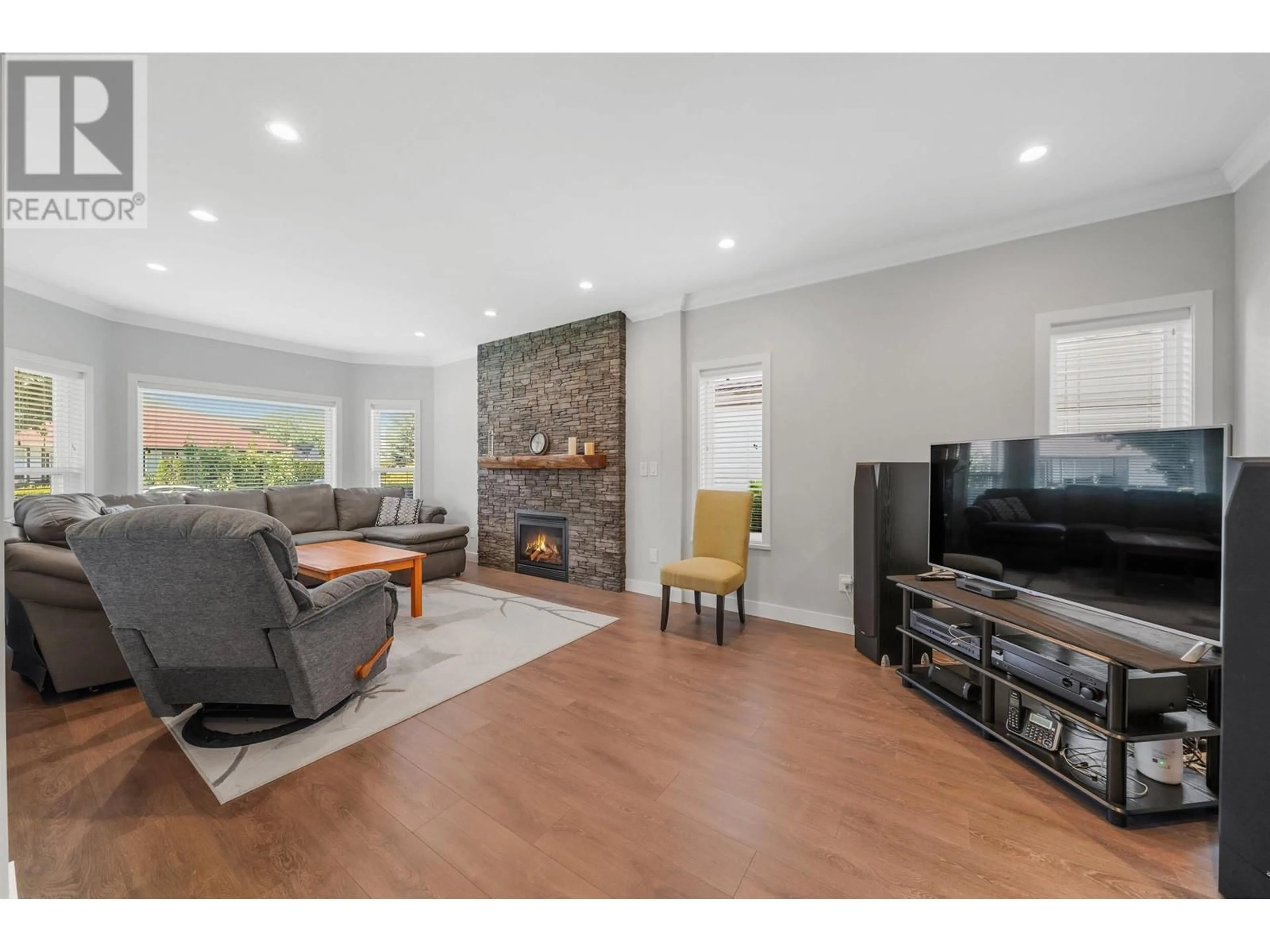 Living room with furniture, wood/laminate floor for 23845 106 AVENUE, Maple Ridge British Columbia V2W1E4