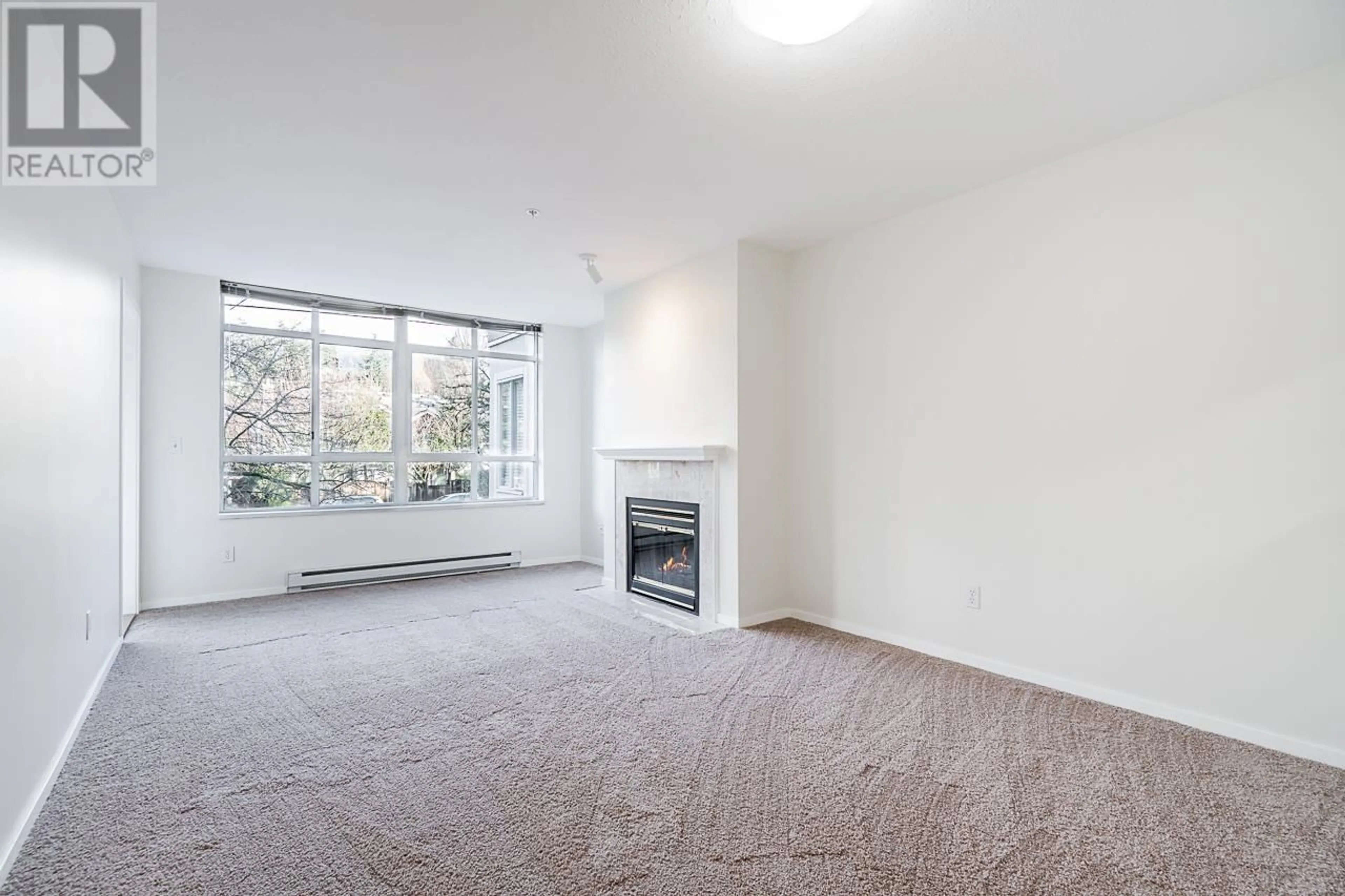 Living room with furniture, carpet floor for 202 855 W 16TH STREET, North Vancouver British Columbia V7P1R2