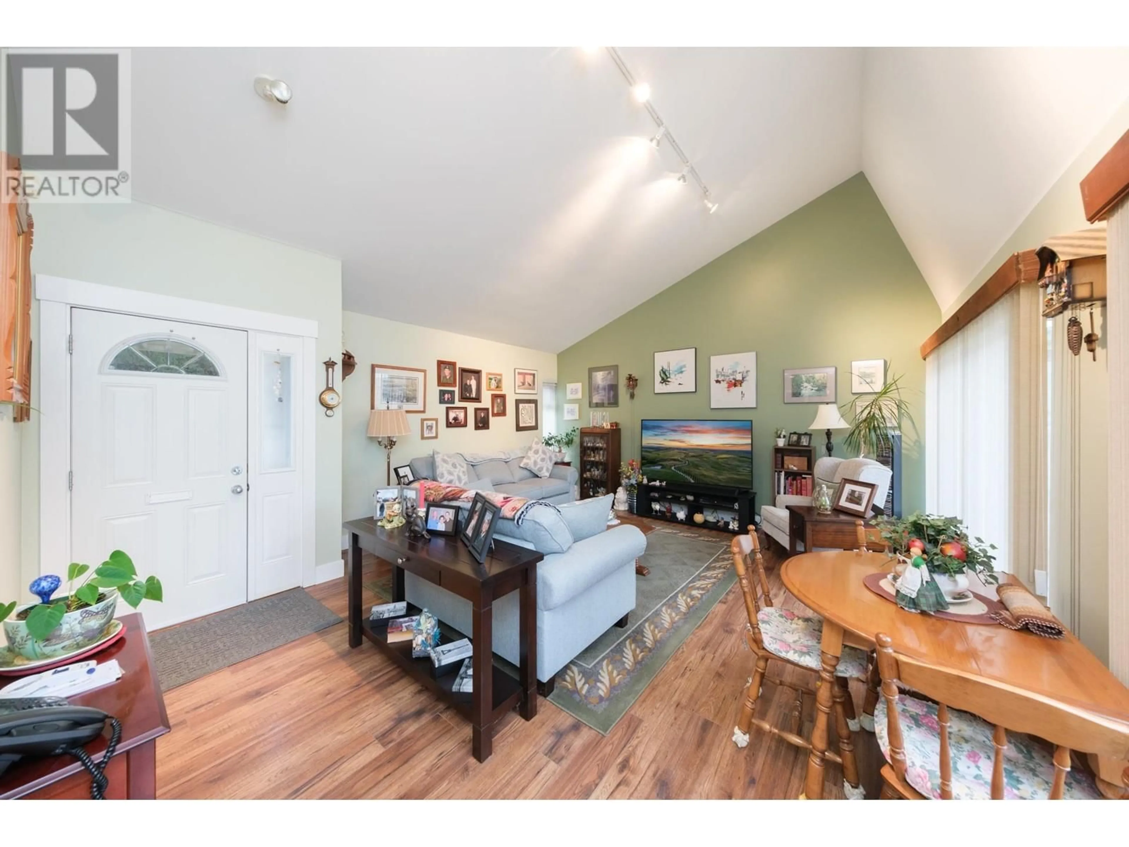 Living room with furniture, wood/laminate floor for 7342 CELISTA DRIVE, Vancouver British Columbia V5S4A1