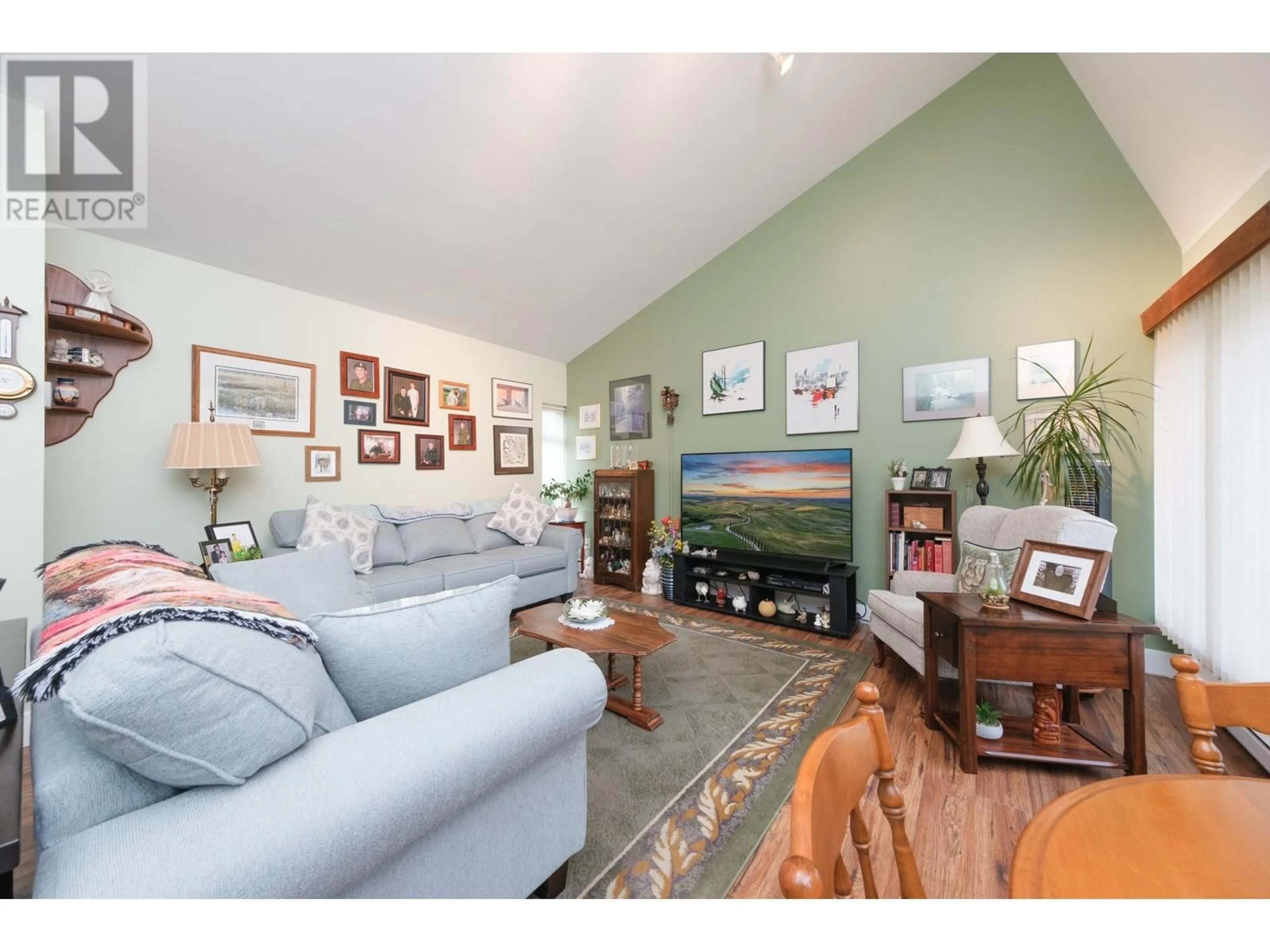 Living room with furniture, wood/laminate floor for 7342 CELISTA DRIVE, Vancouver British Columbia V5S4A1