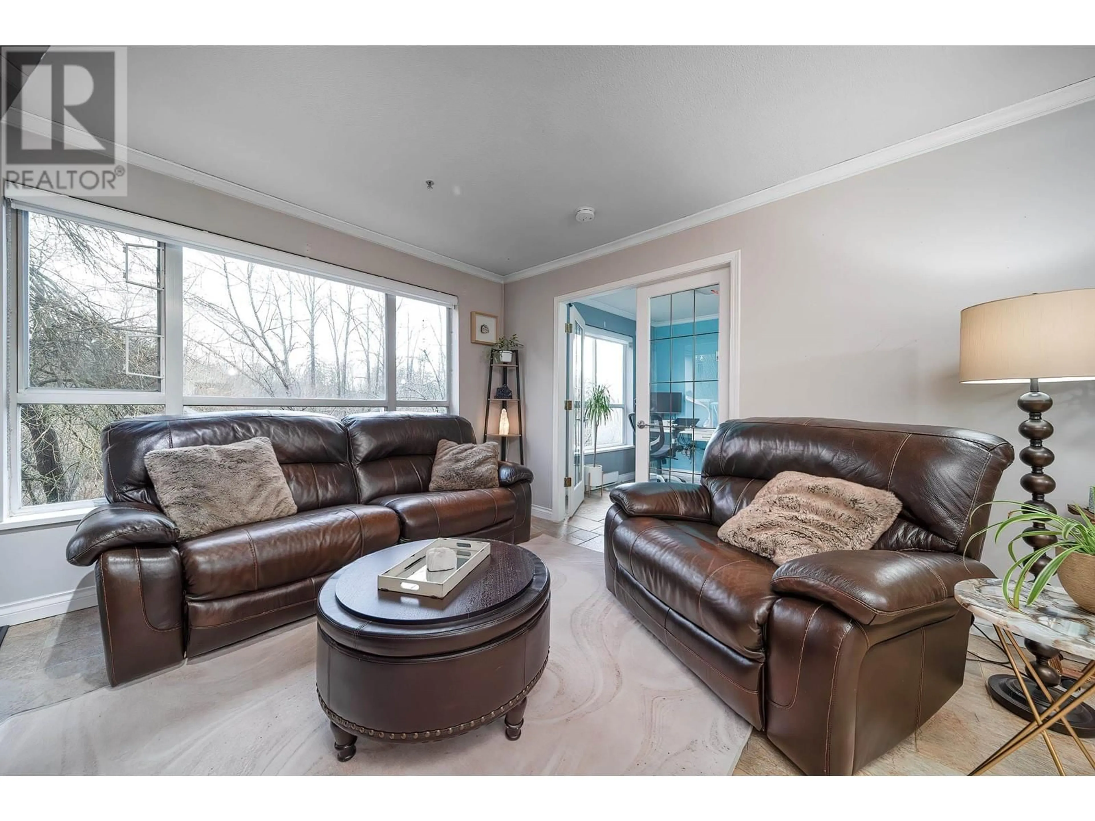 Living room with furniture, wood/laminate floor for 306 2551 PARKVIEW LANE, Port Coquitlam British Columbia V3C6J8