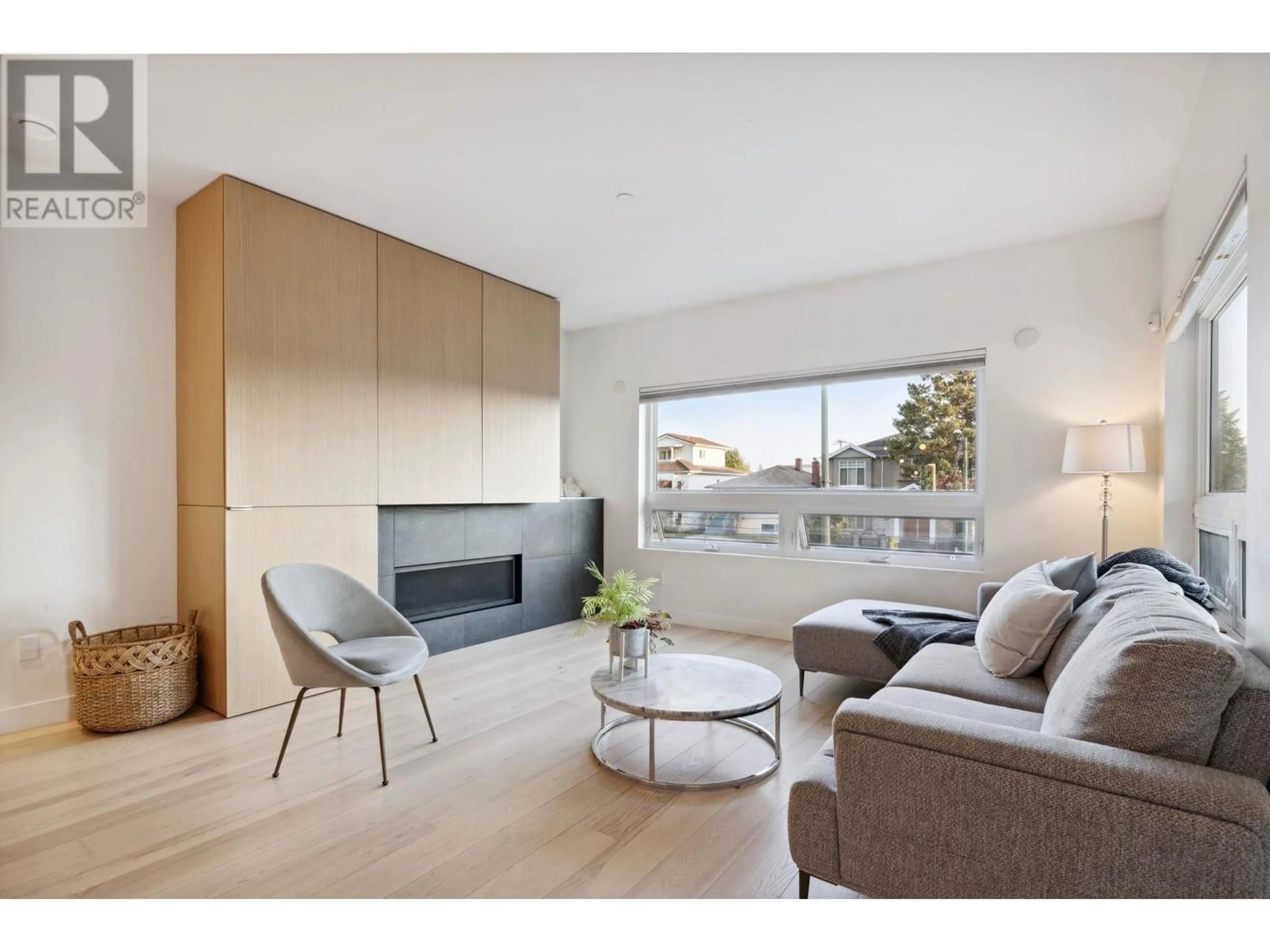 Living room with furniture, wood/laminate floor for 57 W 41ST AVENUE, Vancouver British Columbia V5Y2R8