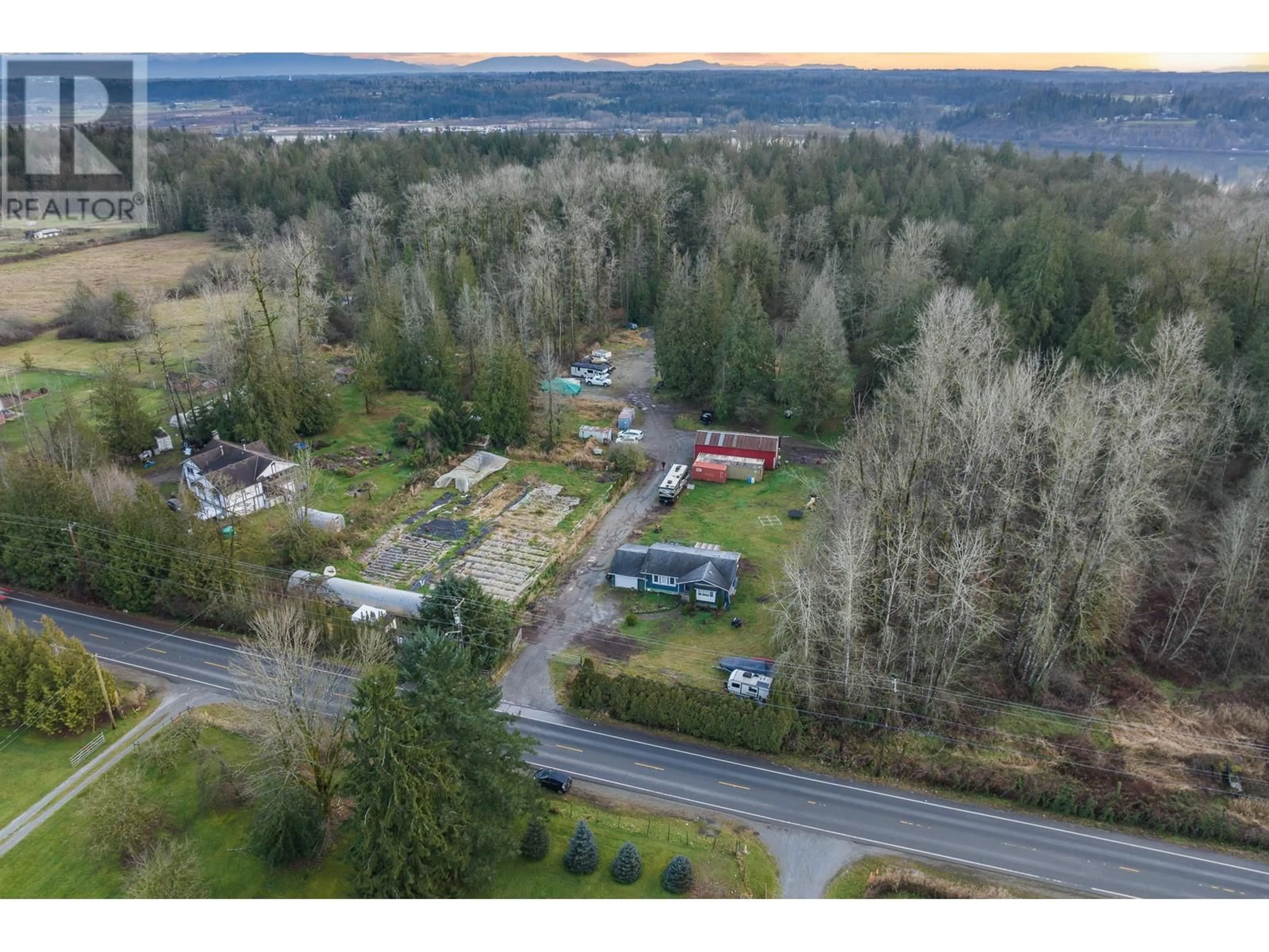 A pic from outside/outdoor area/front of a property/back of a property/a pic from drone, mountain view for 24950 100 AVENUE, Maple Ridge British Columbia V2W1S3