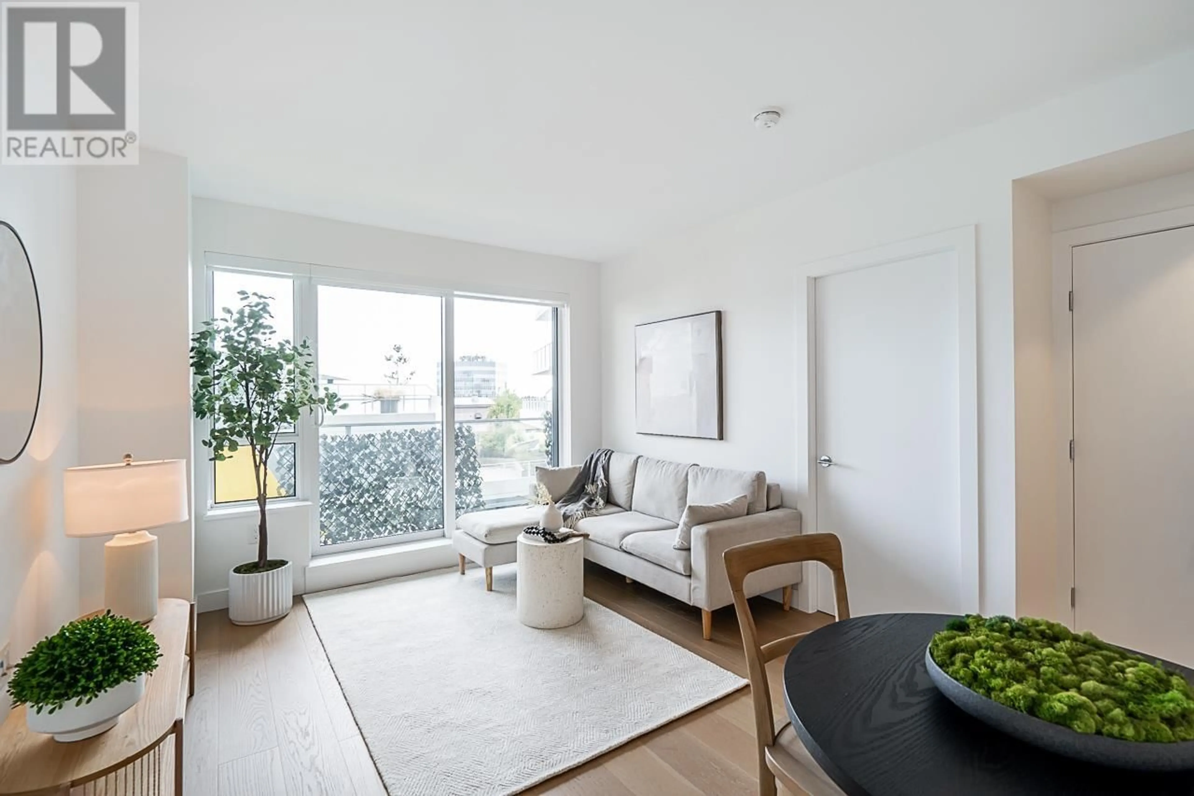 Living room with furniture, wood/laminate floor for 711 5788 GILBERT ROAD, Richmond British Columbia V6X1B7