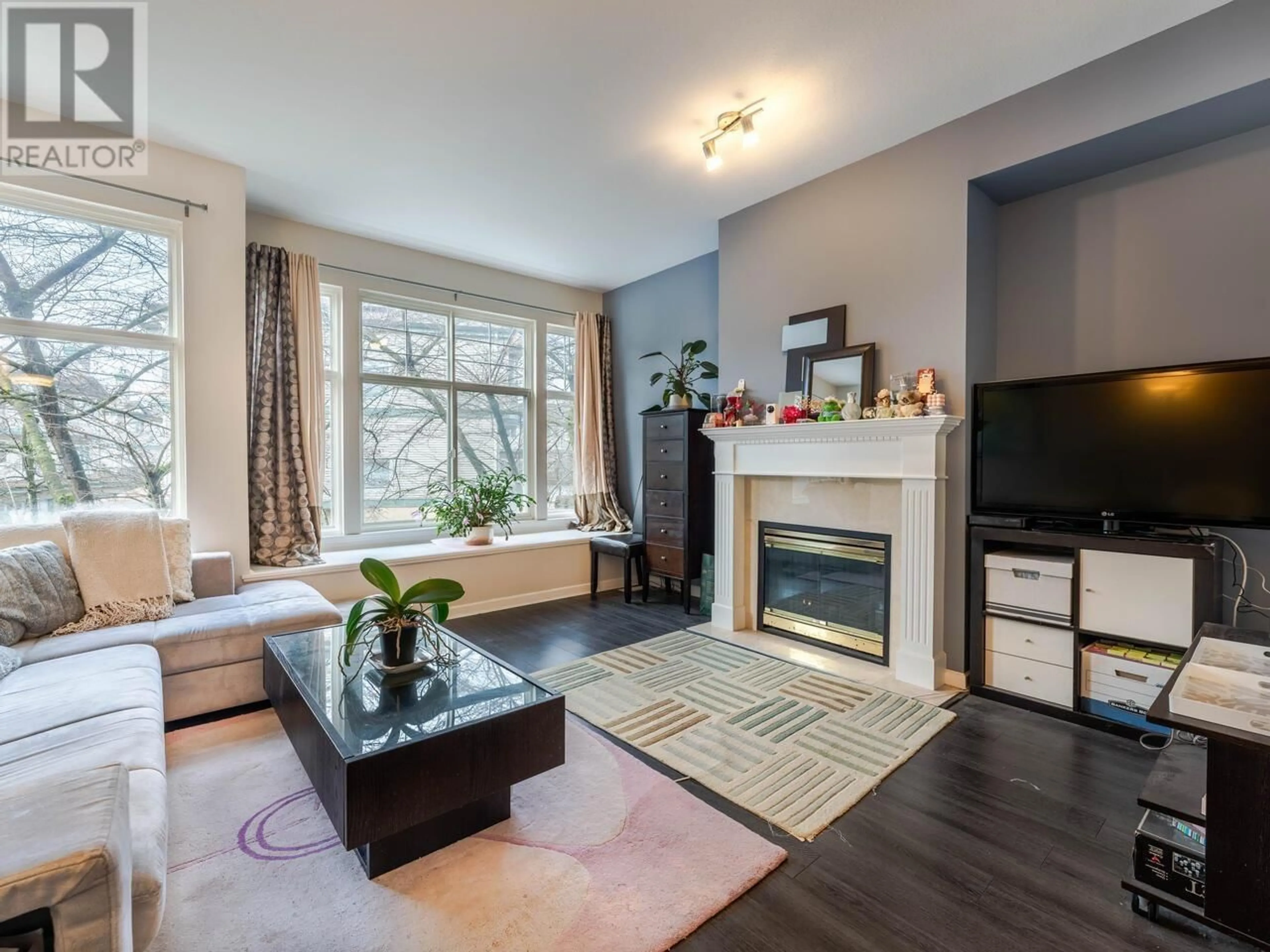 Living room with furniture, wood/laminate floor for 7 22888 WINDSOR COURT, Richmond British Columbia V6V2W6