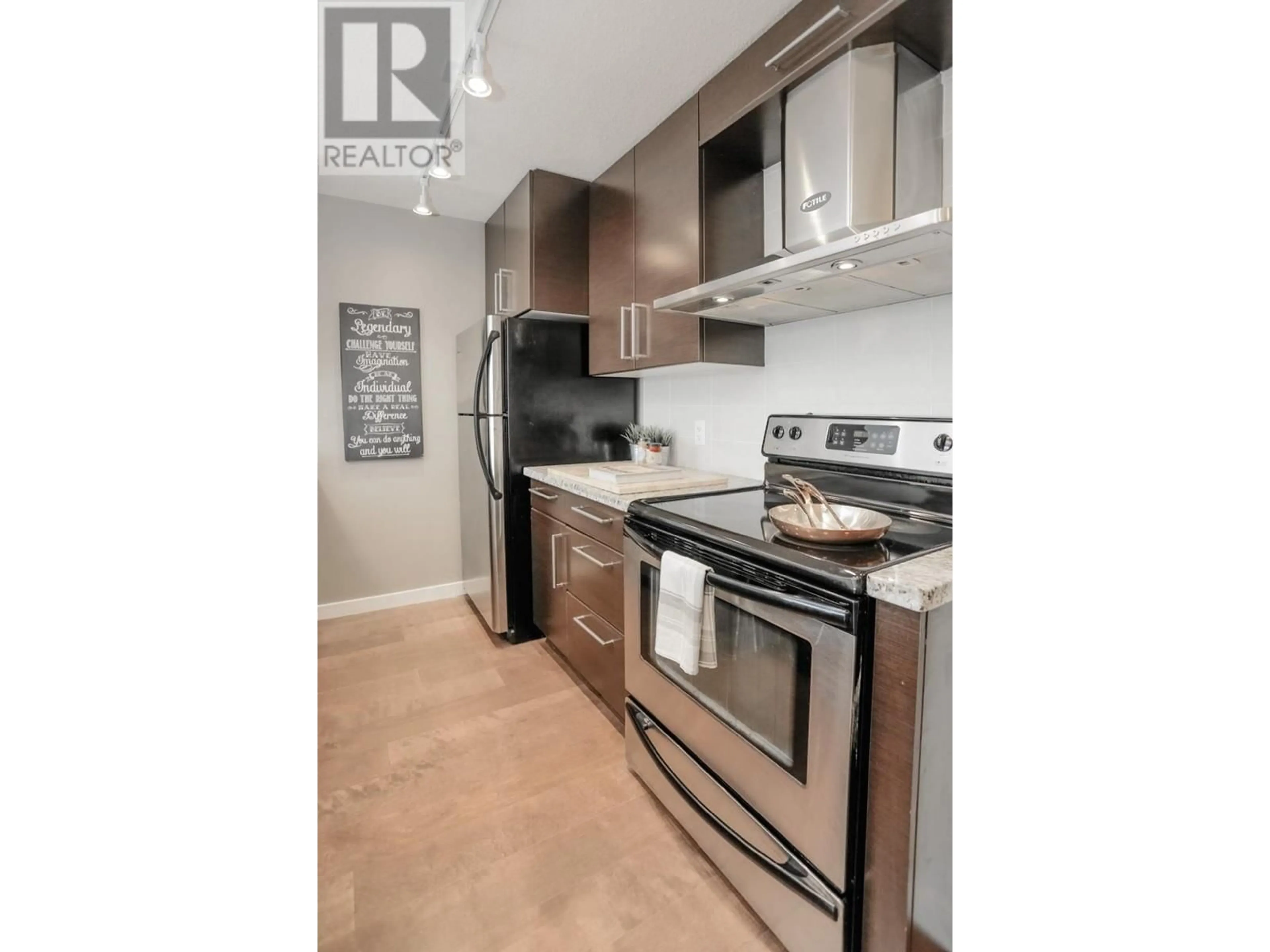 Standard kitchen, wood/laminate floor for 1505 188 KEEFER PLACE, Vancouver British Columbia V6B0J1