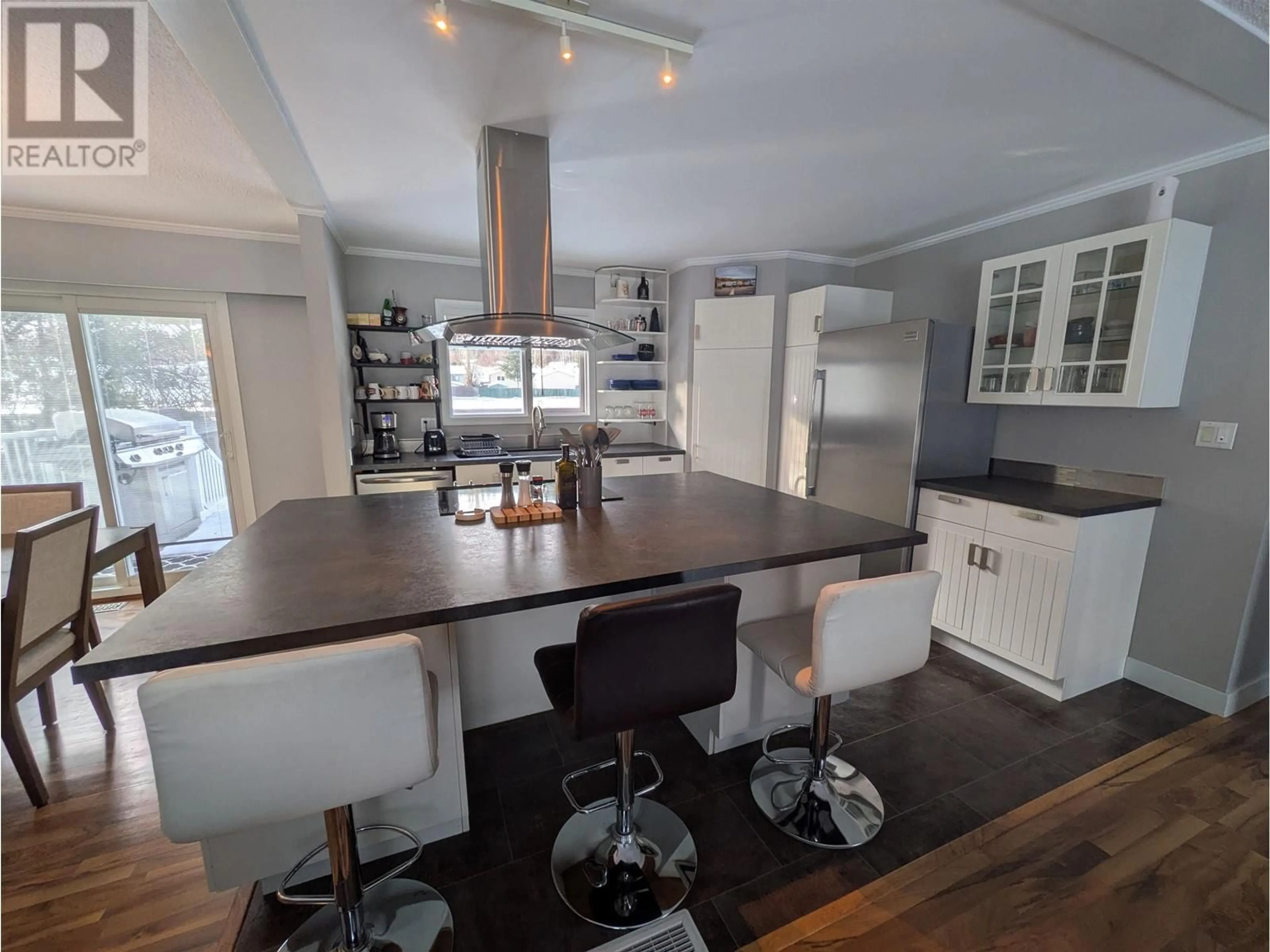 Open concept kitchen, wood/laminate floor for 1057 NELSON CRESCENT, Prince George British Columbia V2M5A1