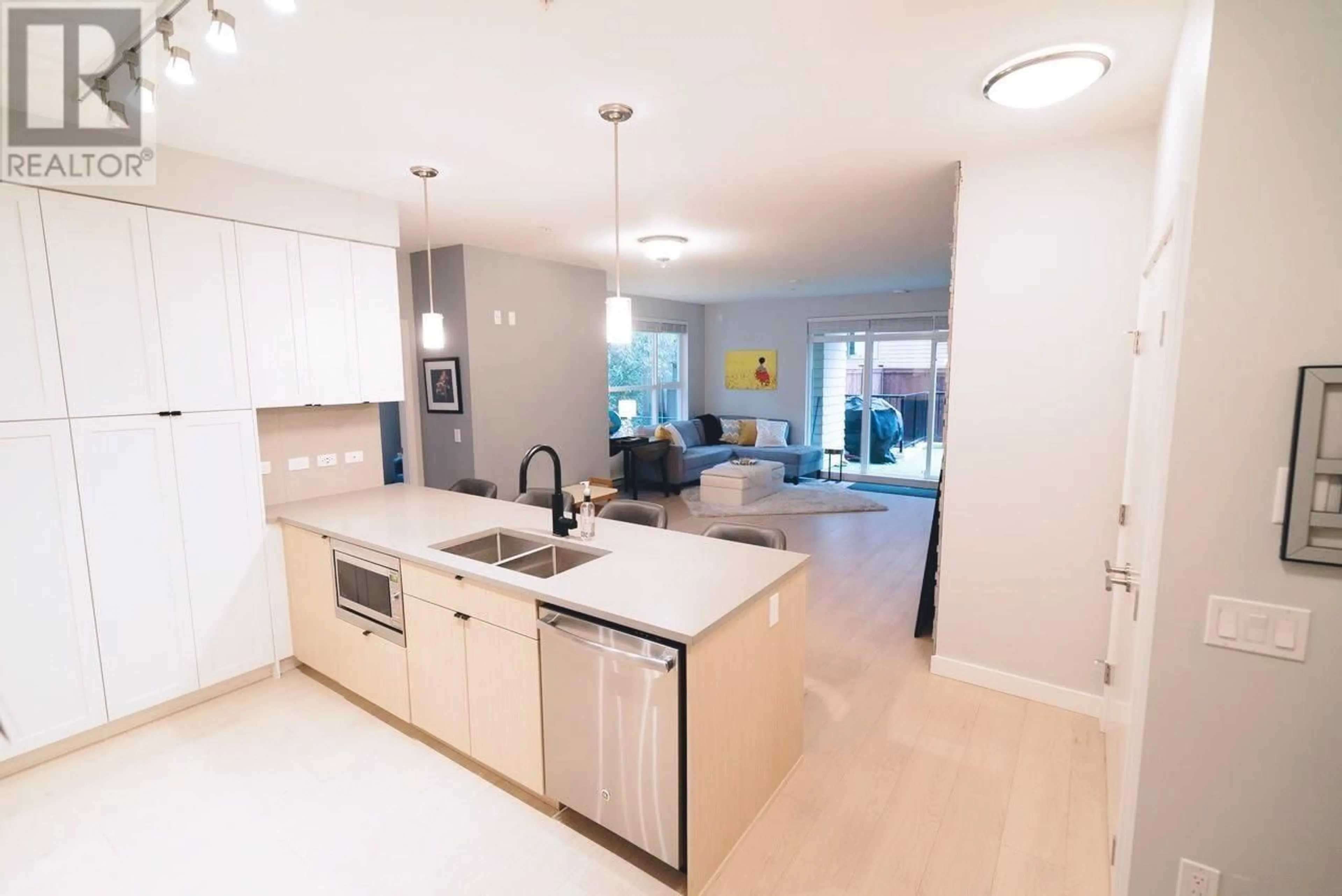 Open concept kitchen, ceramic/tile floor for 112 3205 MOUNTAIN HIGHWAY, North Vancouver British Columbia V7K0A3