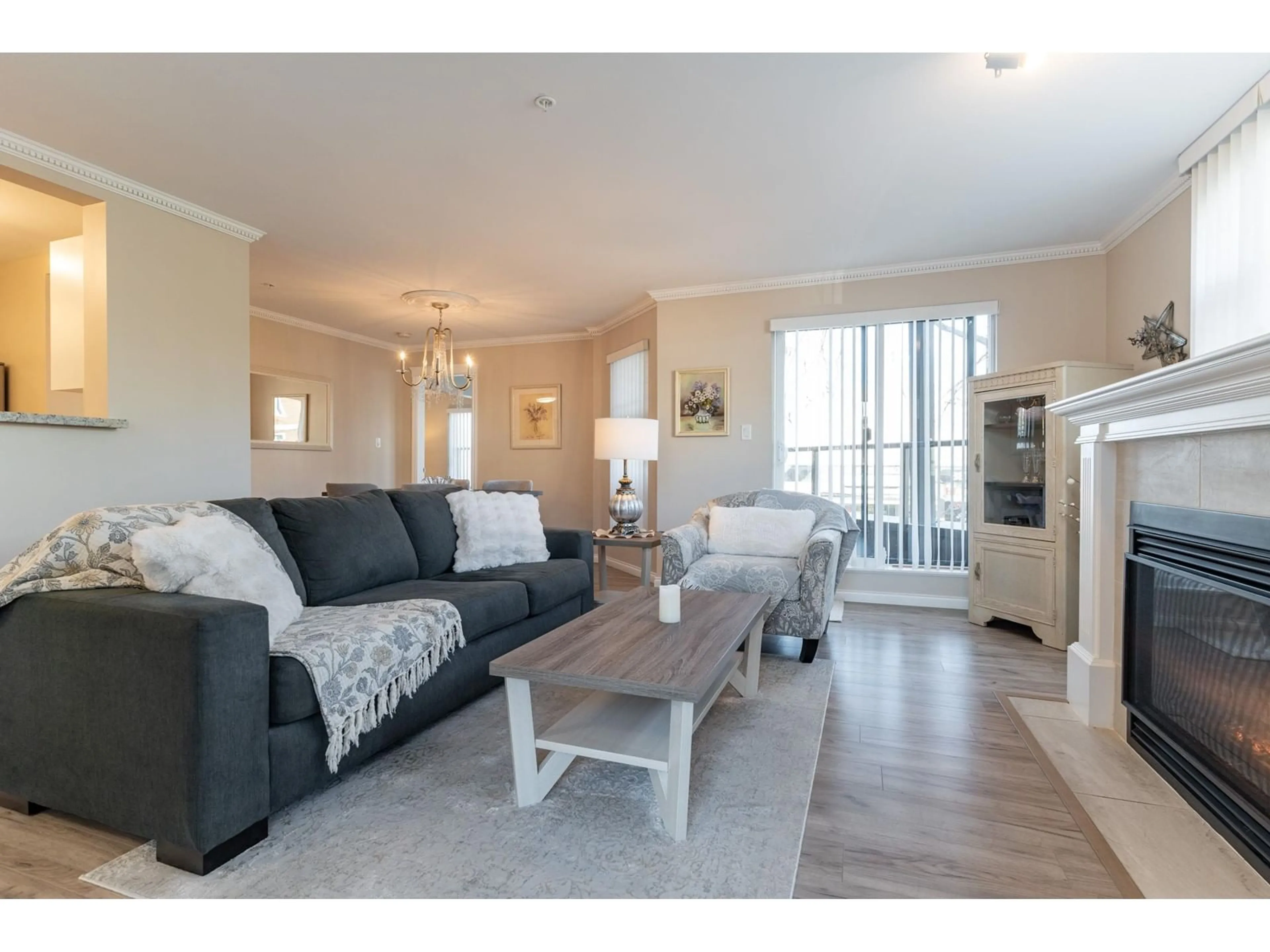 Living room with furniture, wood/laminate floor for 309 15210 PACIFIC AVENUE, White Rock British Columbia V4B5L2