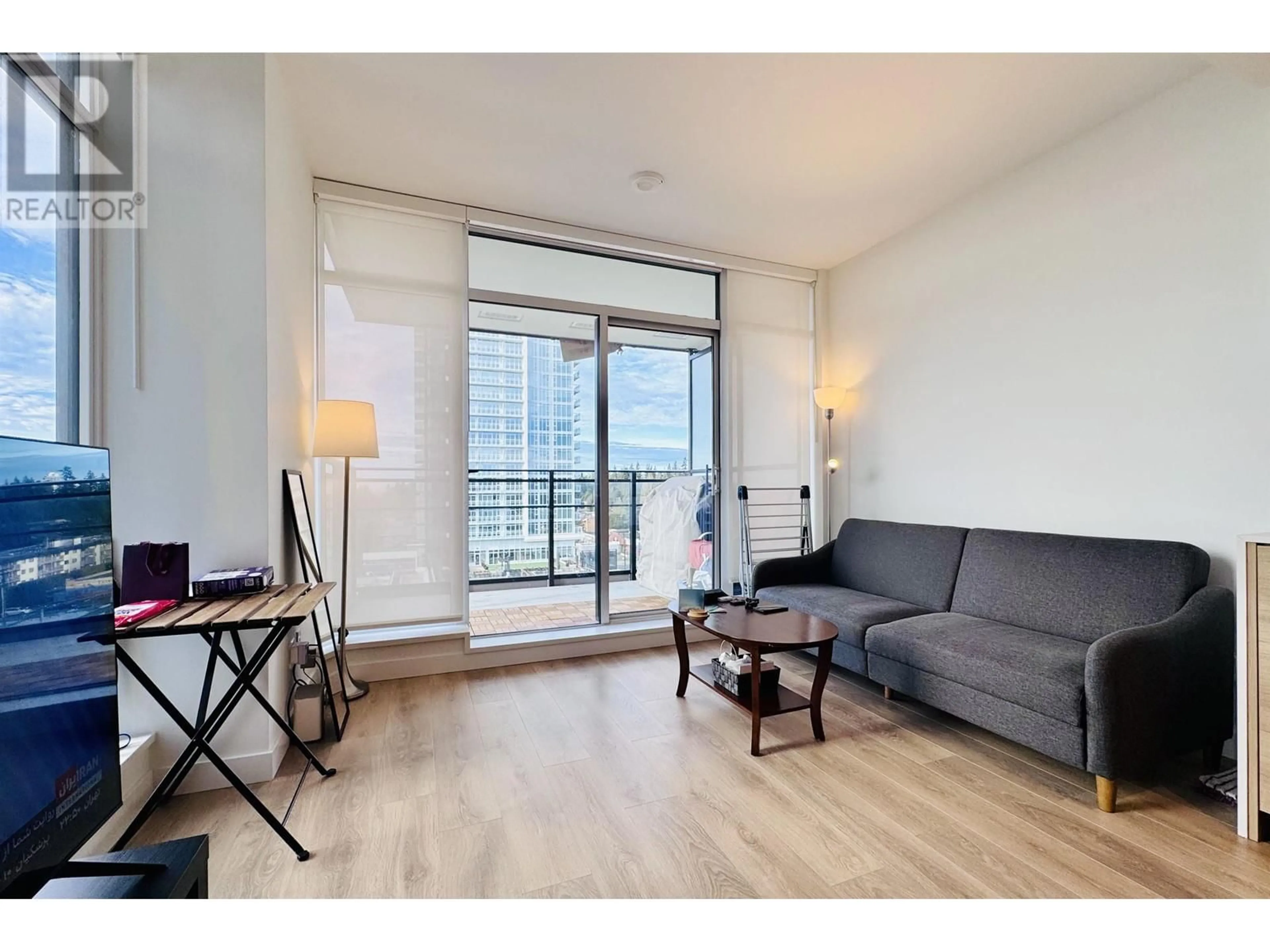 Living room with furniture, wood/laminate floor for 806 - 1045 AUSTIN AVENUE, Coquitlam British Columbia V3K0G9