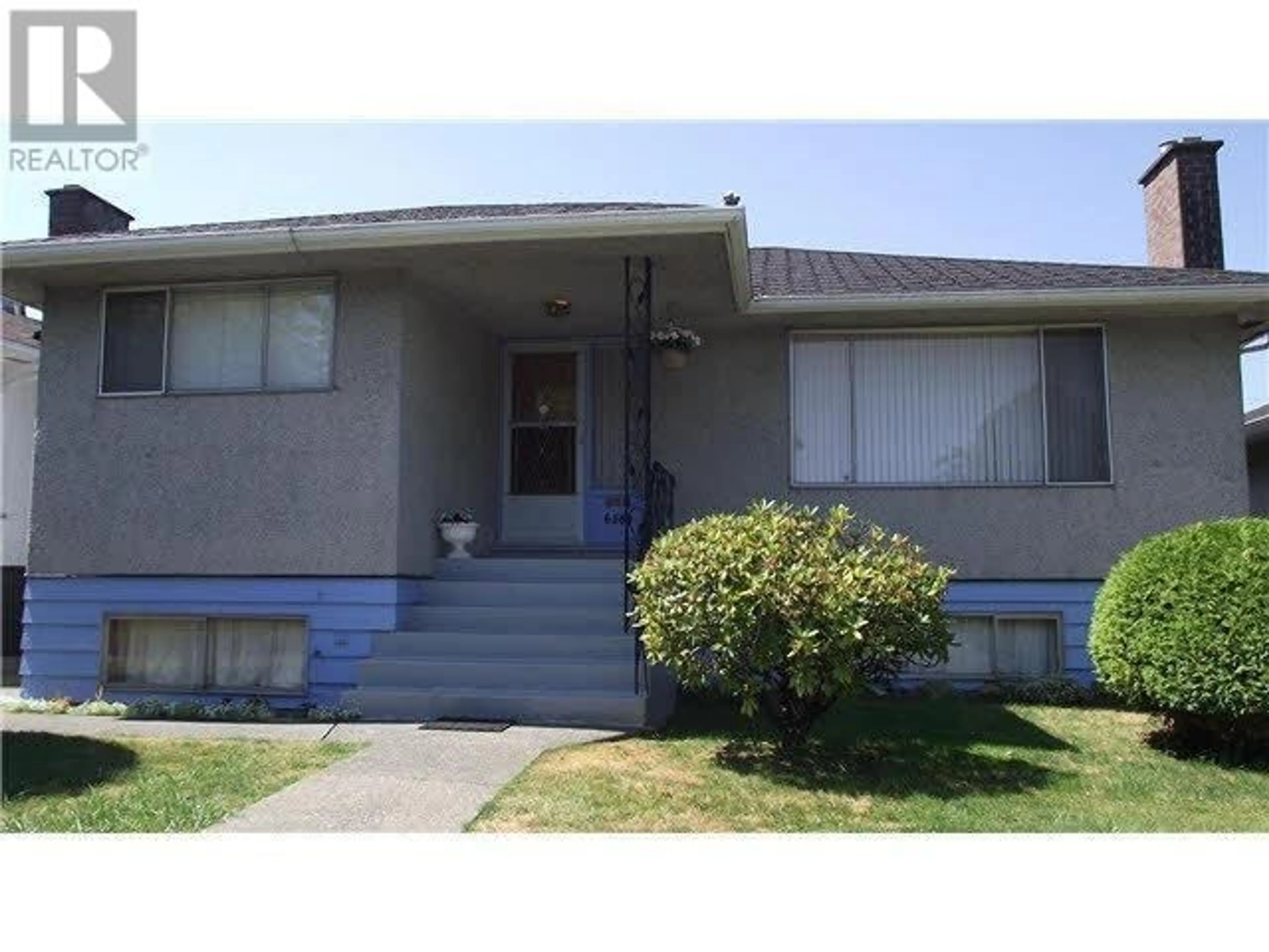 Home with vinyl exterior material, street for 6589 ELLIOTT STREET, Vancouver British Columbia V5S2M6