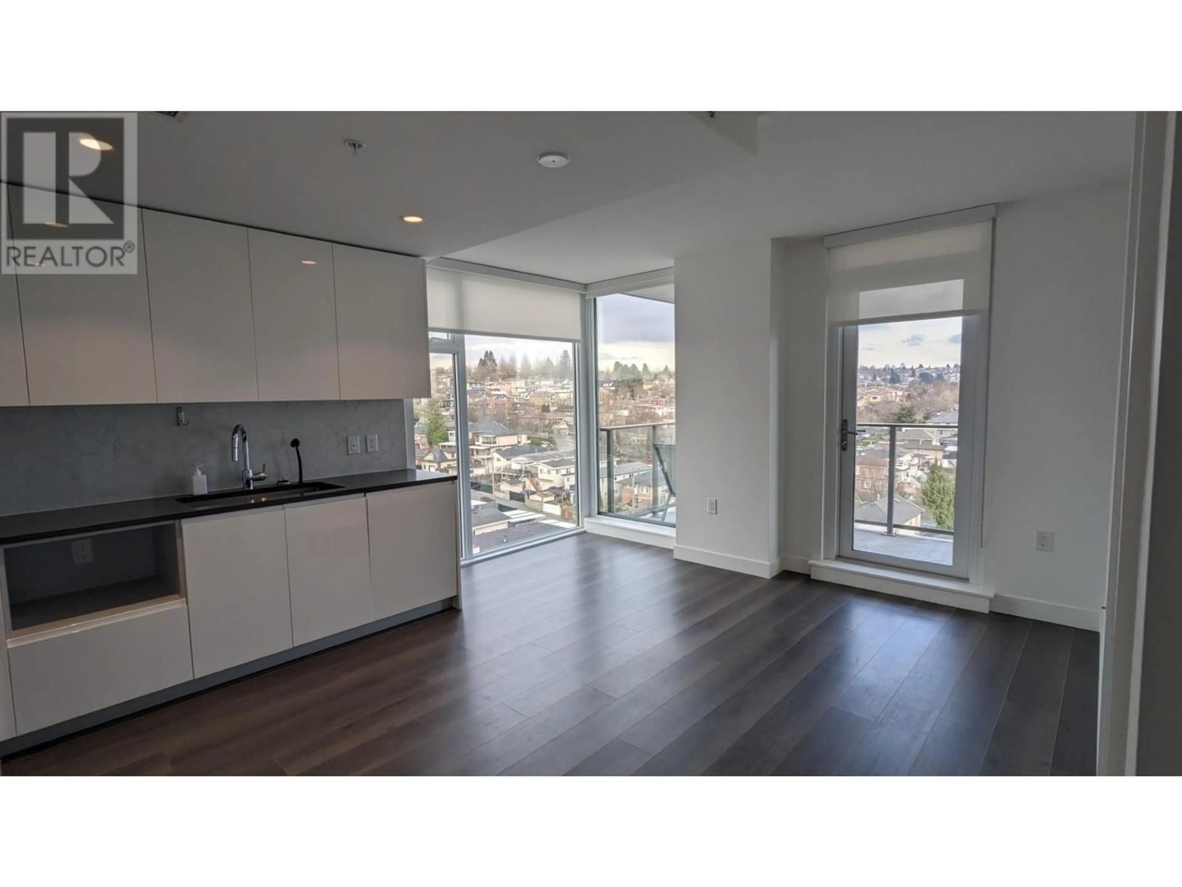 Open concept kitchen, wood/laminate floor for 1003 8181 CHESTER STREET, Vancouver British Columbia V5X0J9