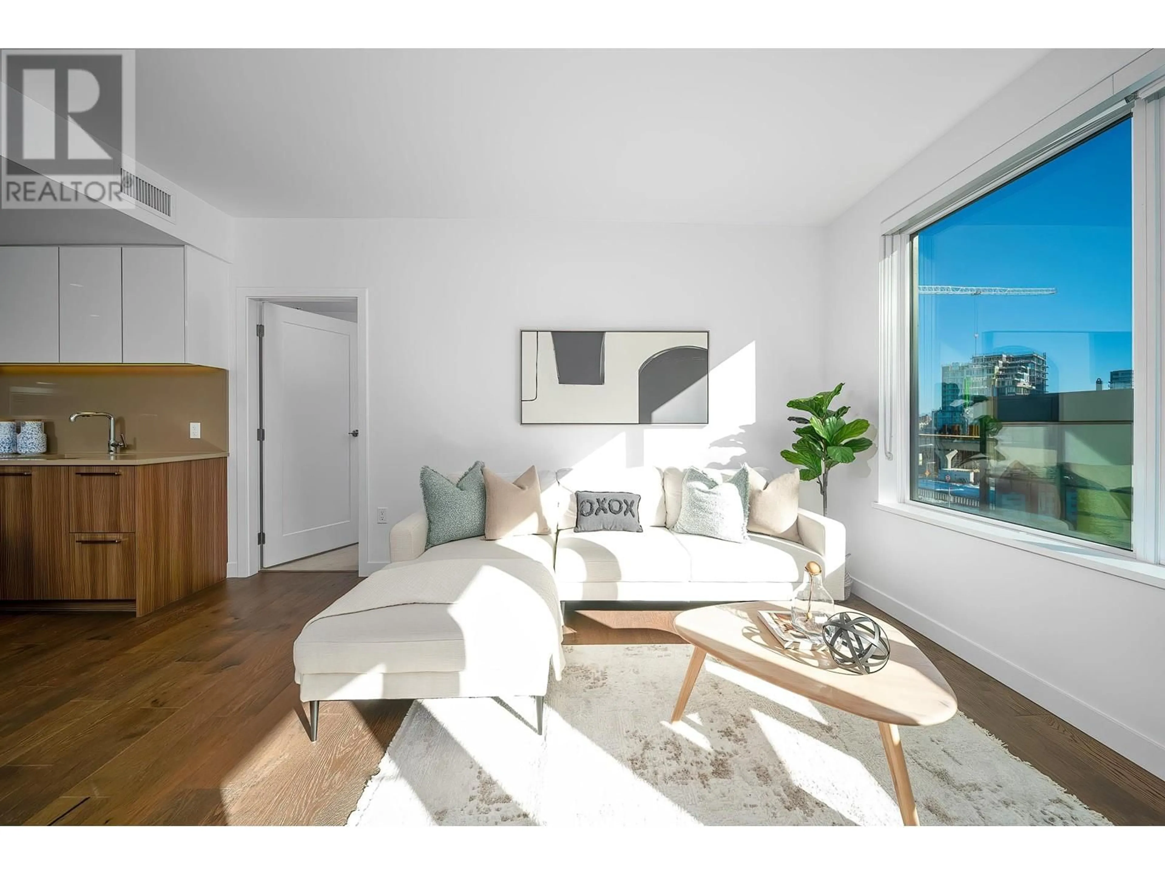 Living room with furniture, wood/laminate floor for 612 8160 MCMYN WAY, Richmond British Columbia V6X0V2