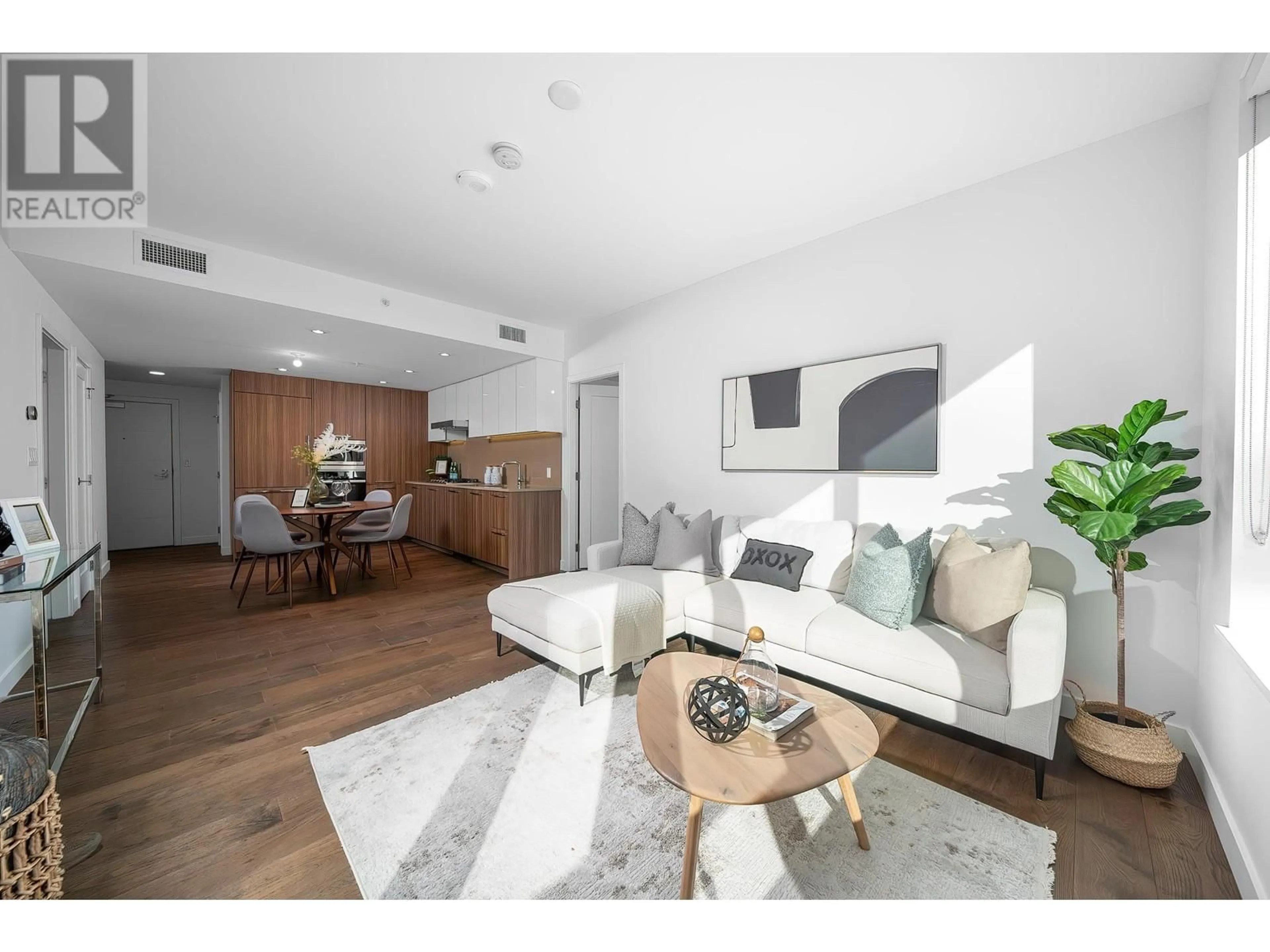 Living room with furniture, wood/laminate floor for 612 8160 MCMYN WAY, Richmond British Columbia V6X0V2