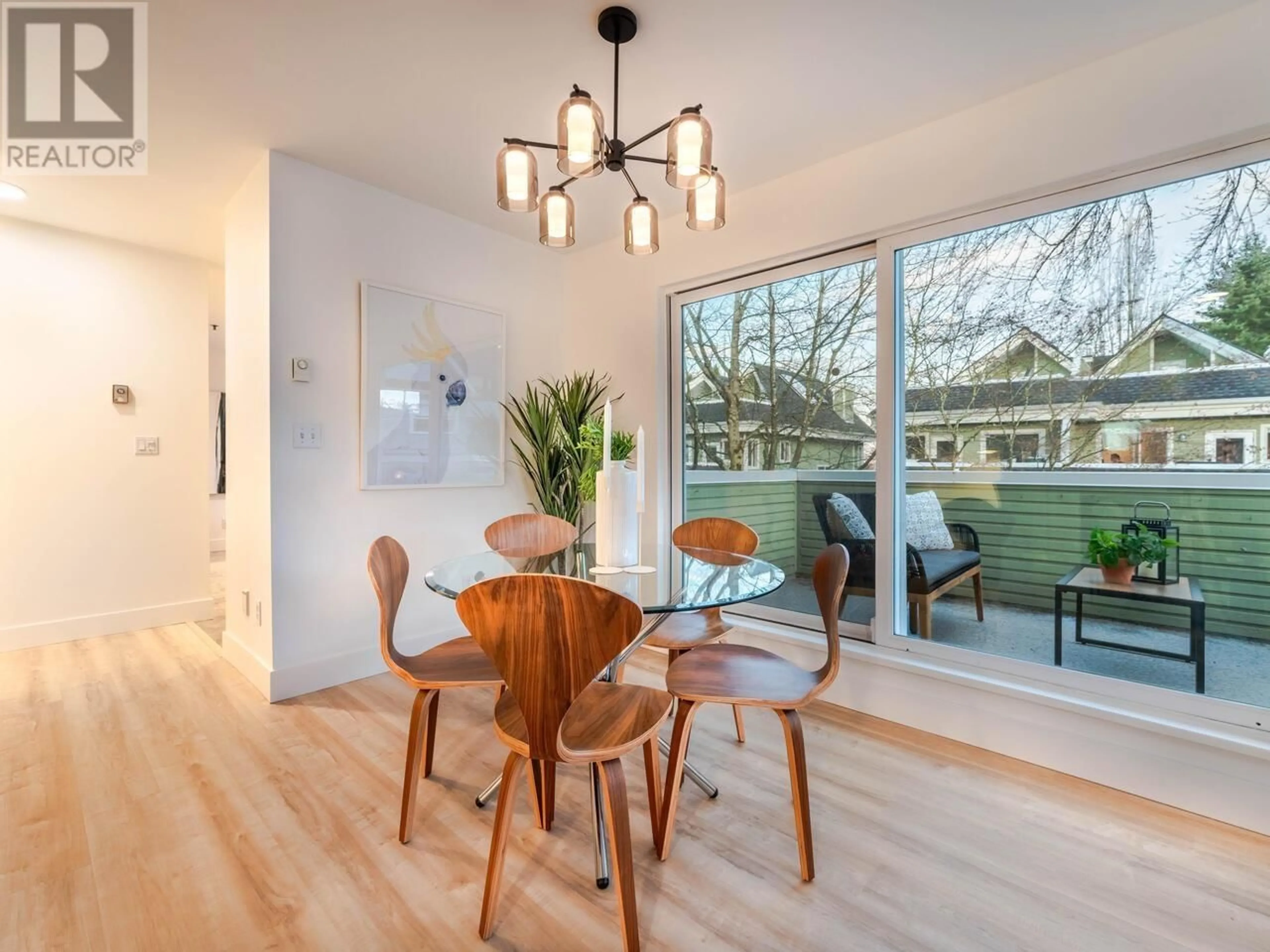 Dining room, wood/laminate floor for 8 4153 SOPHIA STREET, Vancouver British Columbia V5V3V4