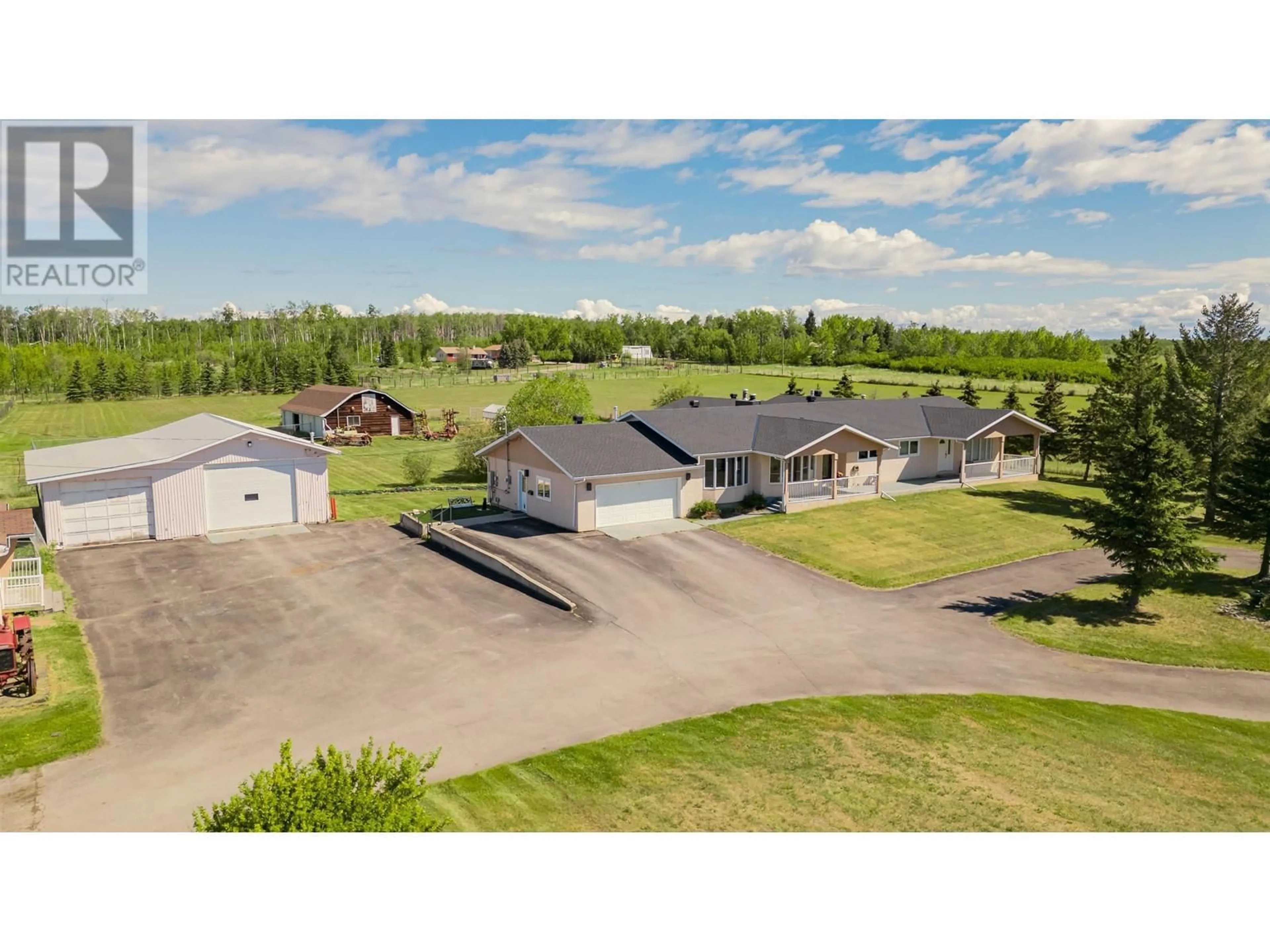 A pic from outside/outdoor area/front of a property/back of a property/a pic from drone, unknown for 7187 257 ROAD, Fort St. John British Columbia V1J4M6