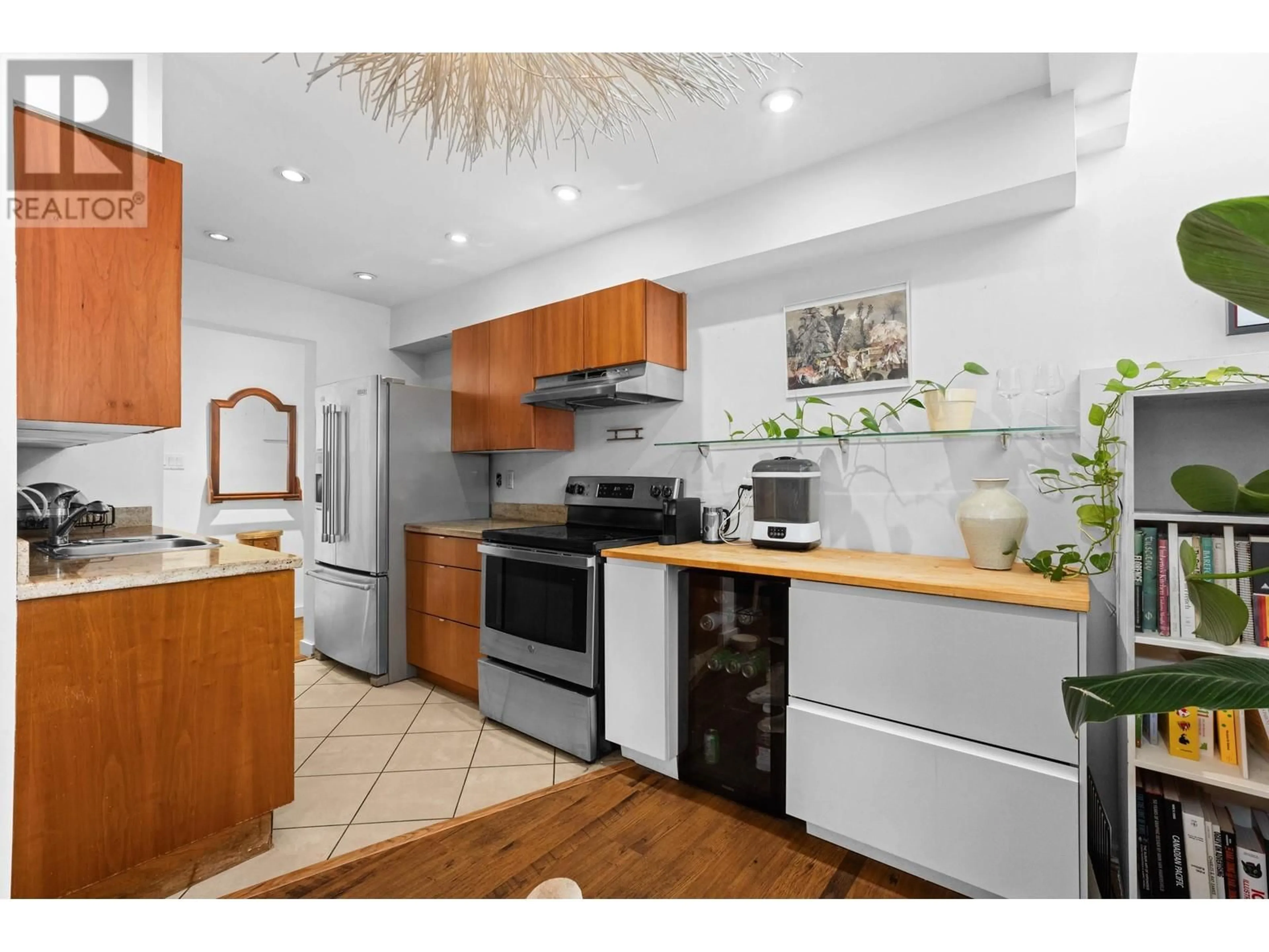 Open concept kitchen, wood/laminate floor for 109 1855 NELSON STREET, Vancouver British Columbia V6G1M9