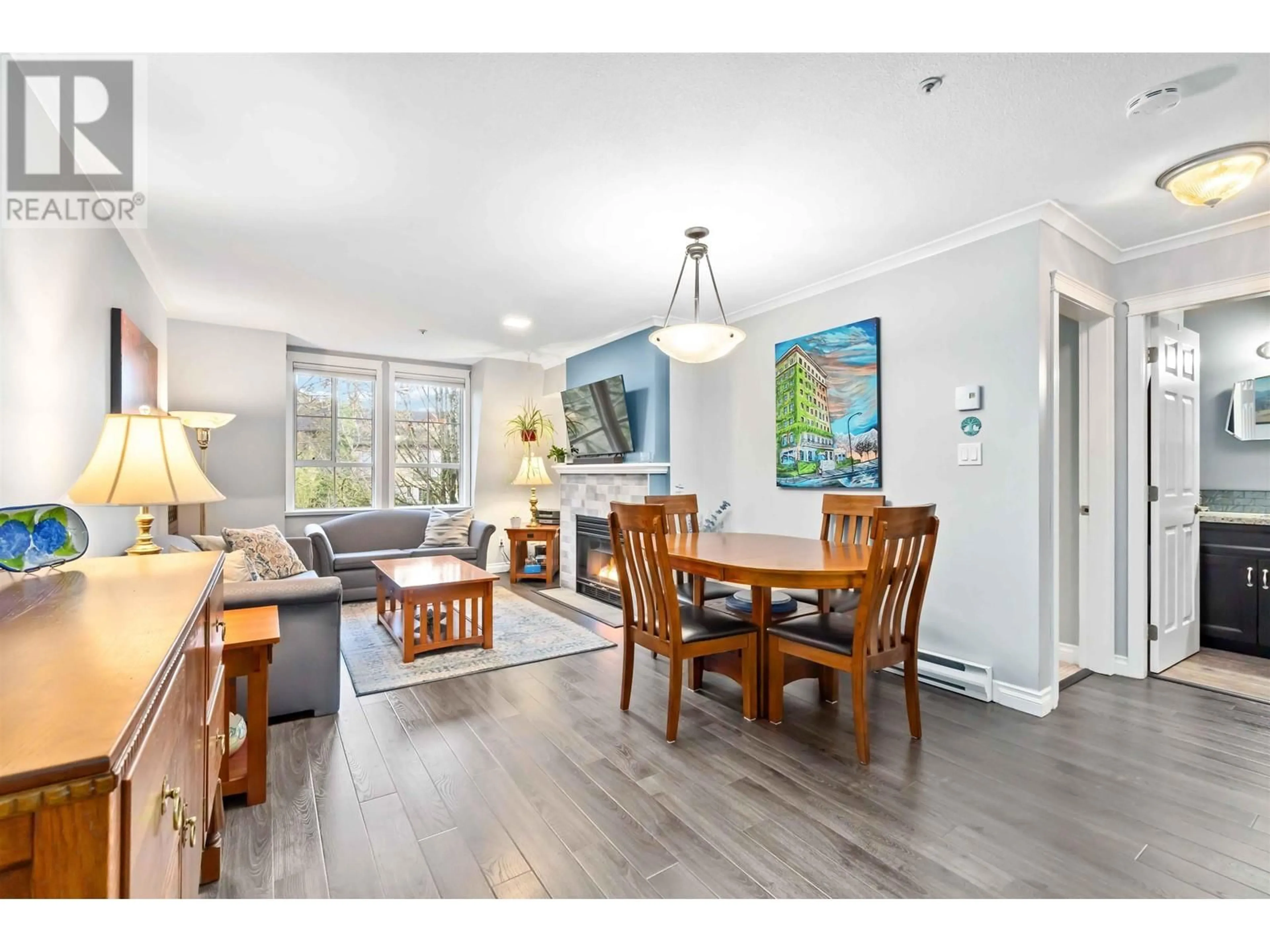 Living room with furniture, wood/laminate floor for 312 295 SCHOOLHOUSE STREET, Coquitlam British Columbia V3K6X5