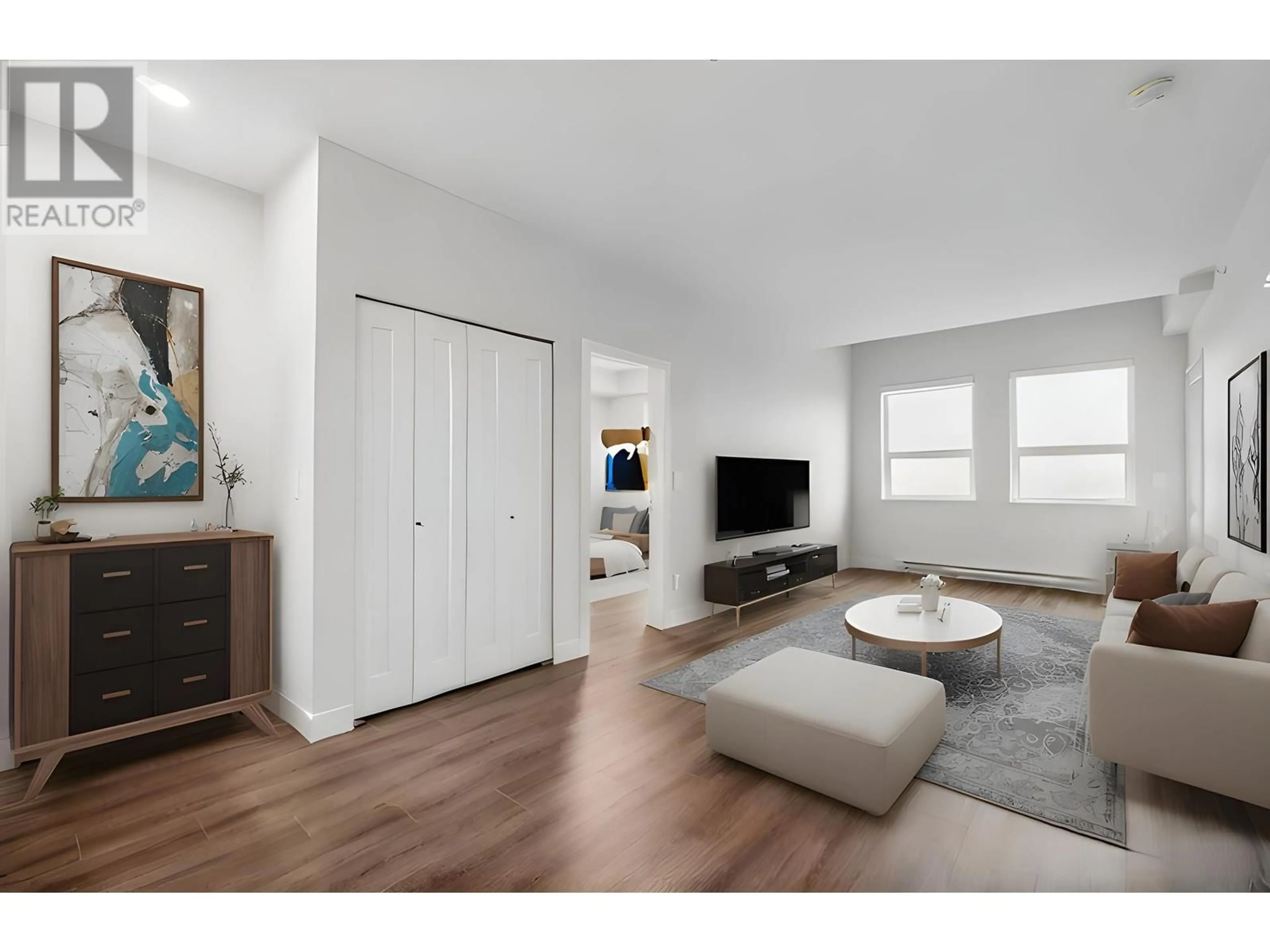 Living room with furniture, wood/laminate floor for 302 - 5535 HASTINGS STREET, Burnaby British Columbia V5B1R2