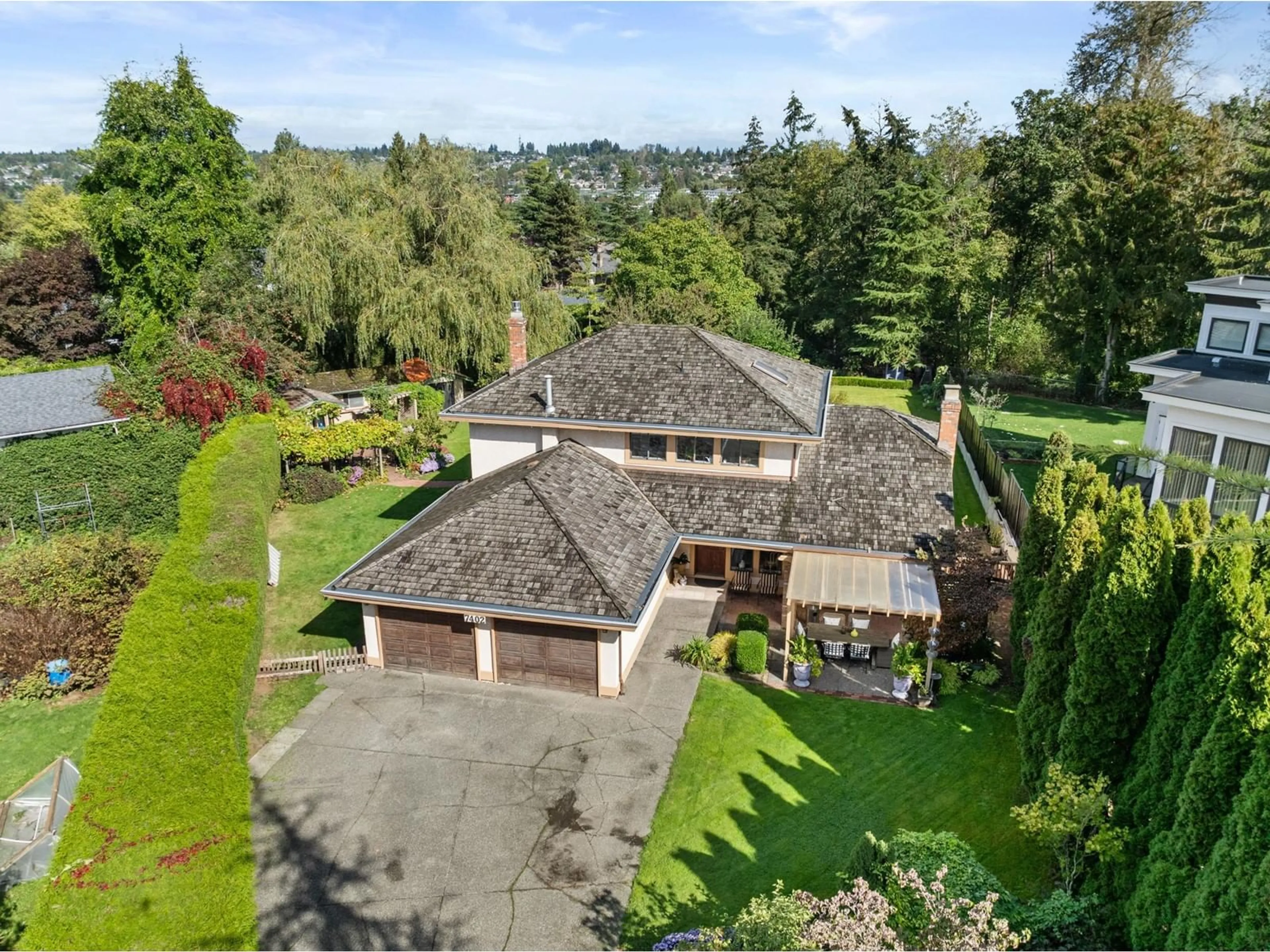 A pic from outside/outdoor area/front of a property/back of a property/a pic from drone, unknown for 7402 149A STREET, Surrey British Columbia V3S3H5