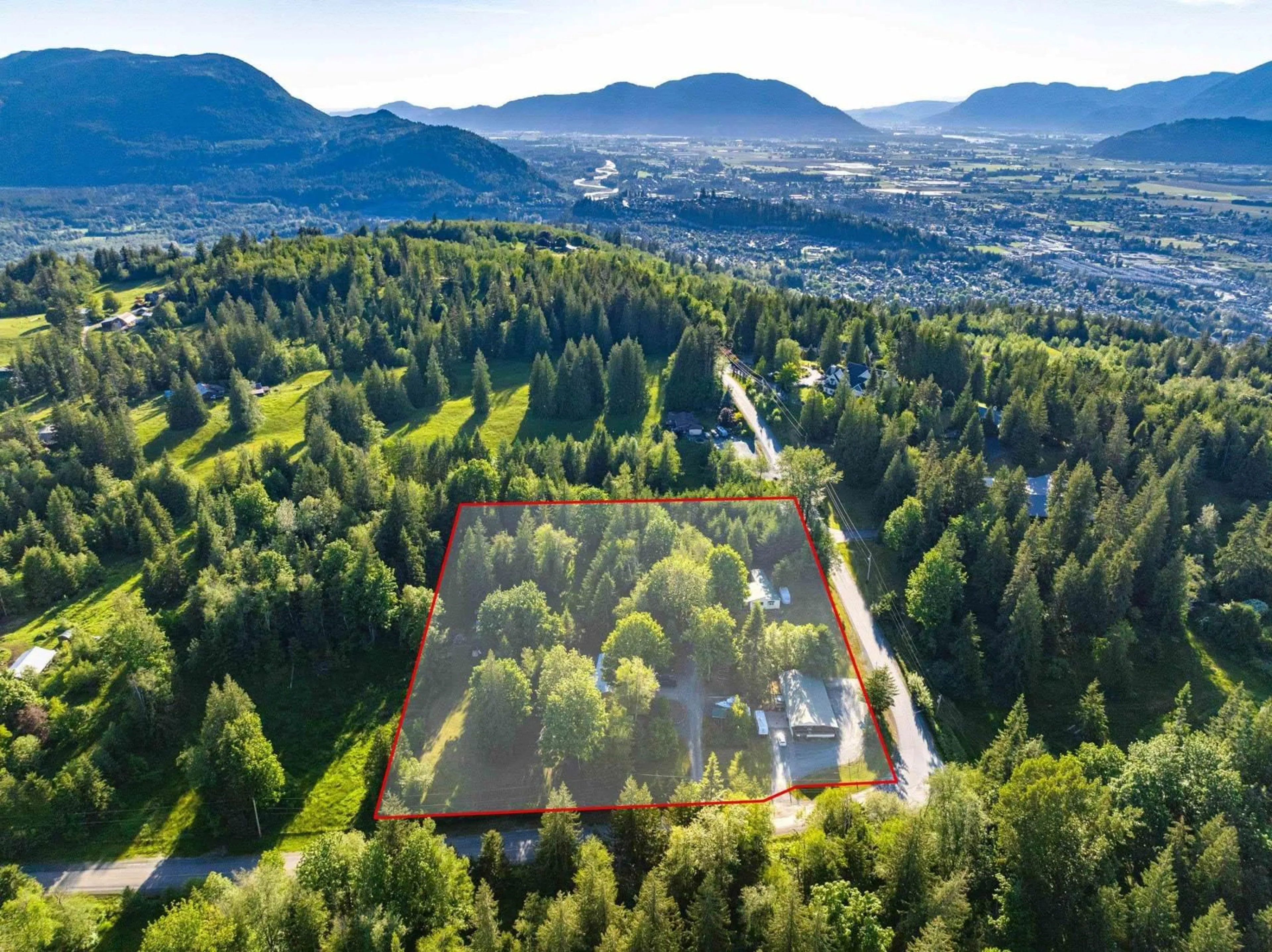 A pic from outside/outdoor area/front of a property/back of a property/a pic from drone, forest/trees view for 47400 EXTROM ROAD|Ryder Lake, Sardis British Columbia V2R4T1