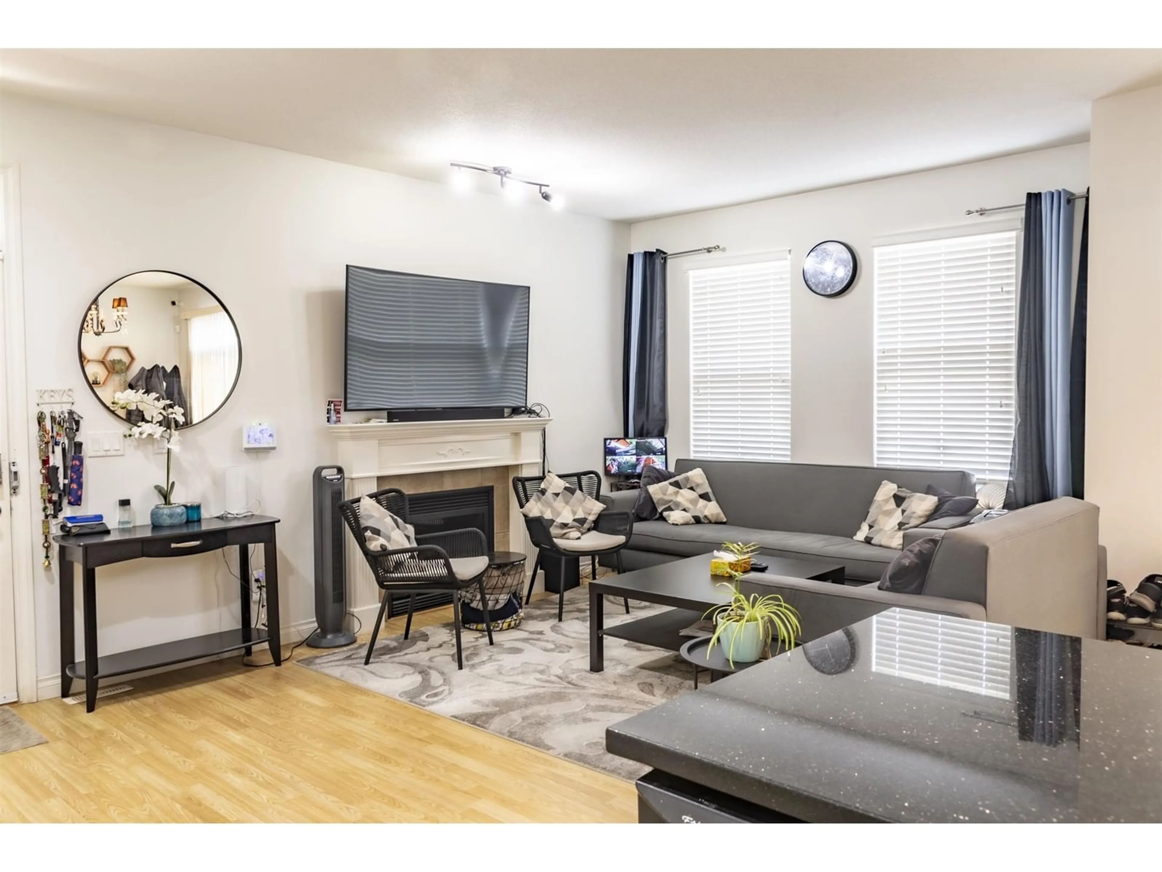 Living room with furniture, wood/laminate floor for 3 - 18055 70, Surrey British Columbia V3S6X3