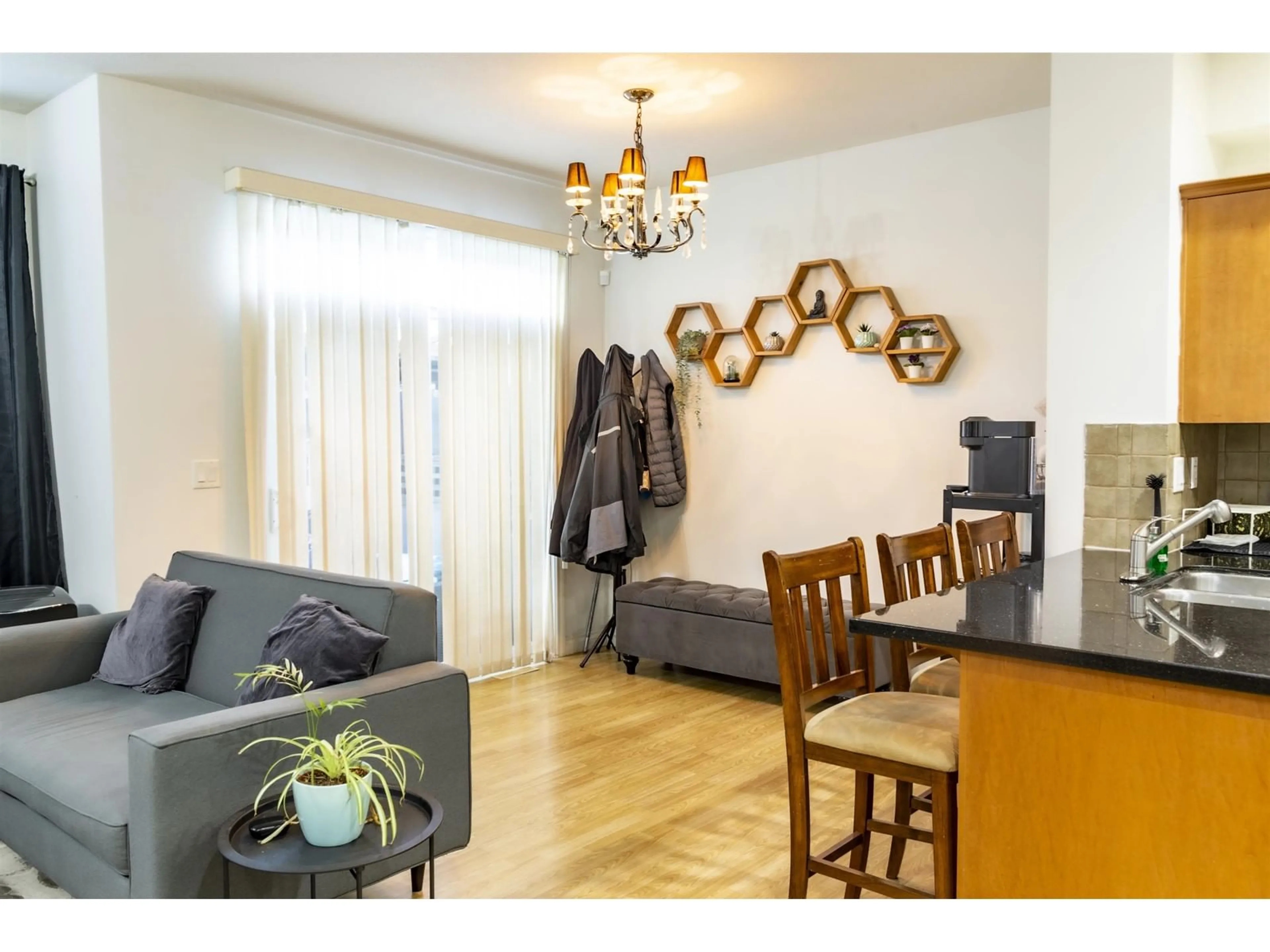 Living room with furniture, wood/laminate floor for 3 - 18055 70, Surrey British Columbia V3S6X3
