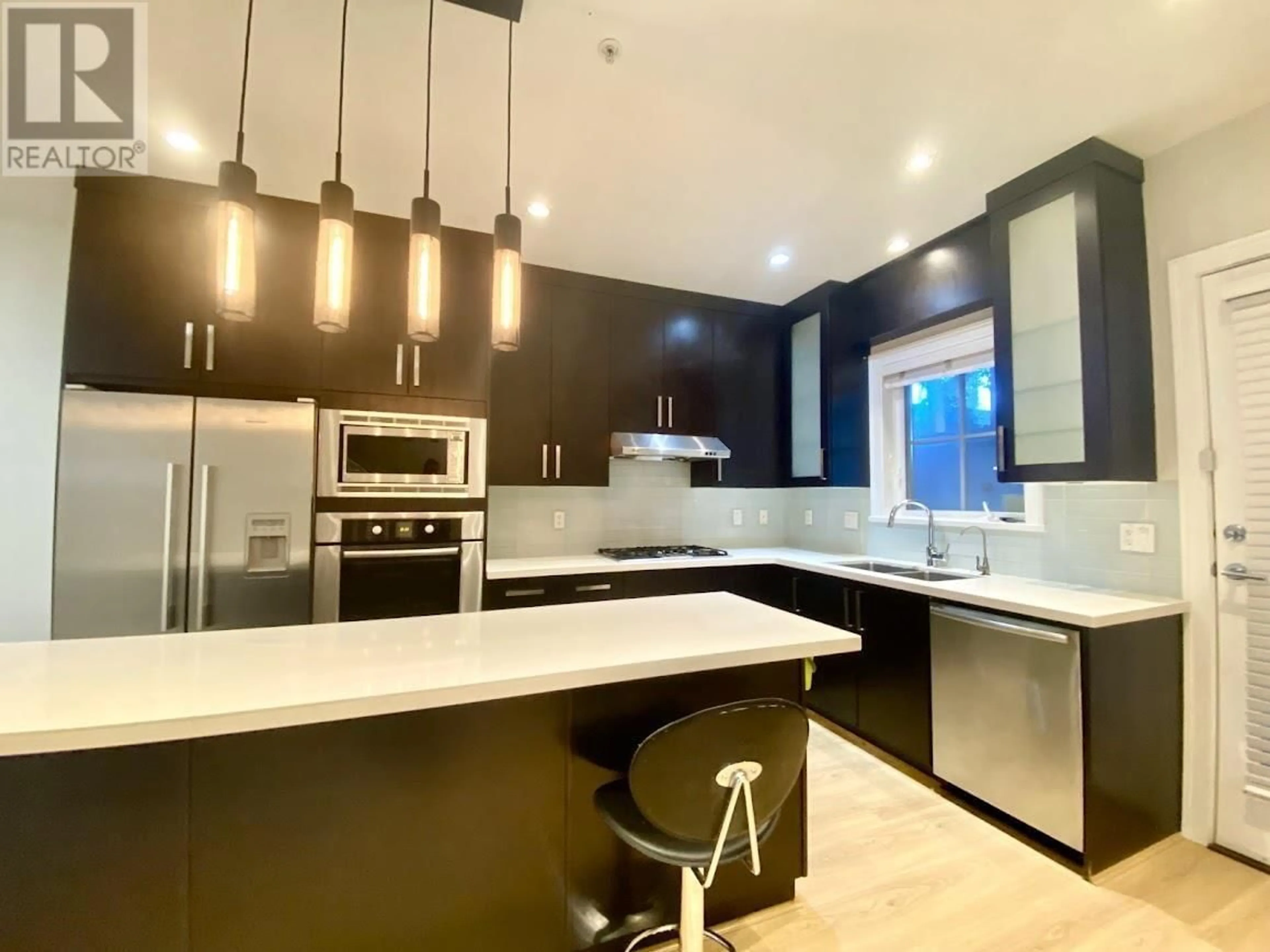 Open concept kitchen, unknown for 1461 TILNEY MEWS, Vancouver British Columbia V6P0B1