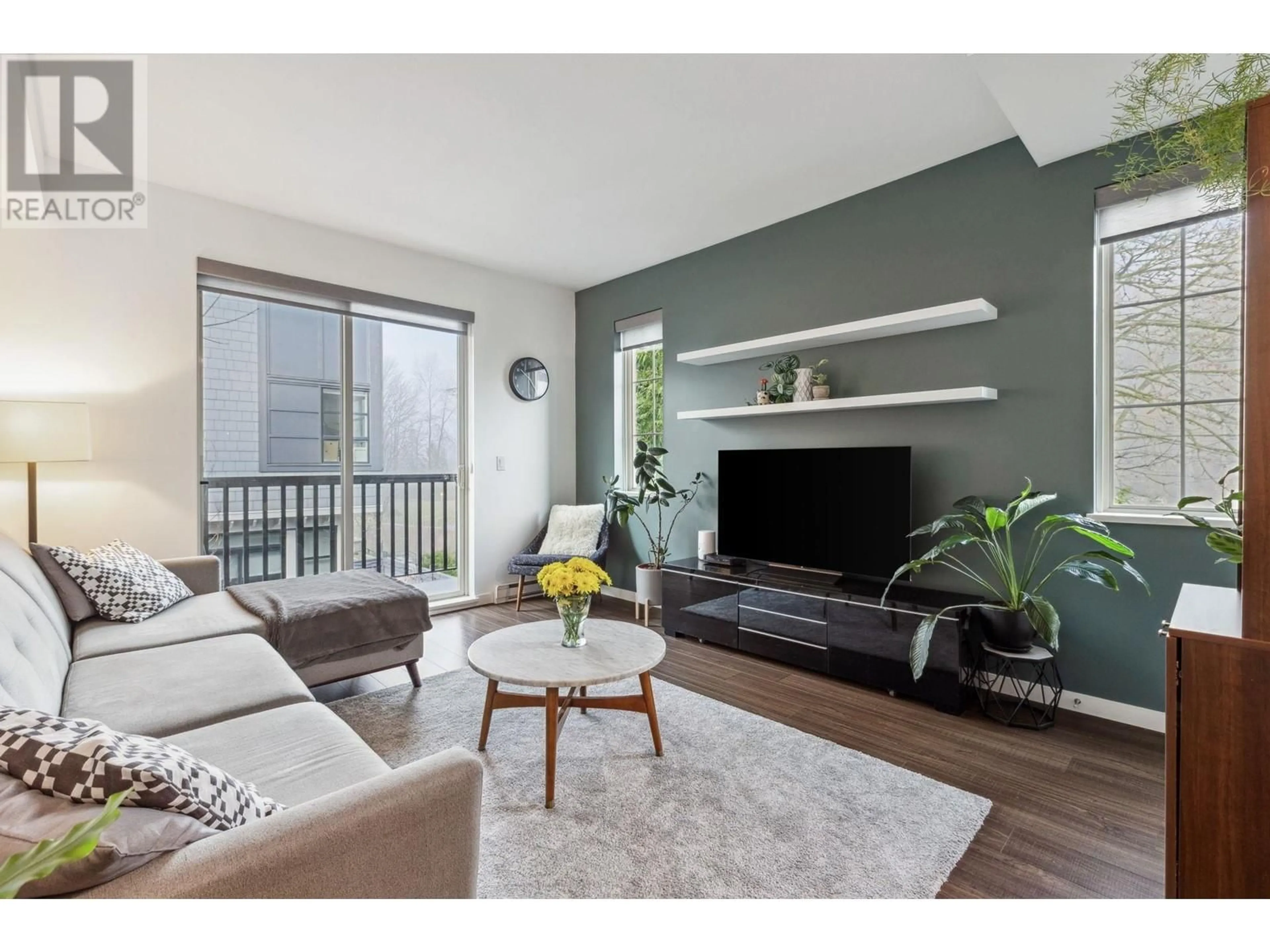 Living room with furniture, wood/laminate floor for 61 433 SEYMOUR RIVER PLACE, North Vancouver British Columbia V7H0B8