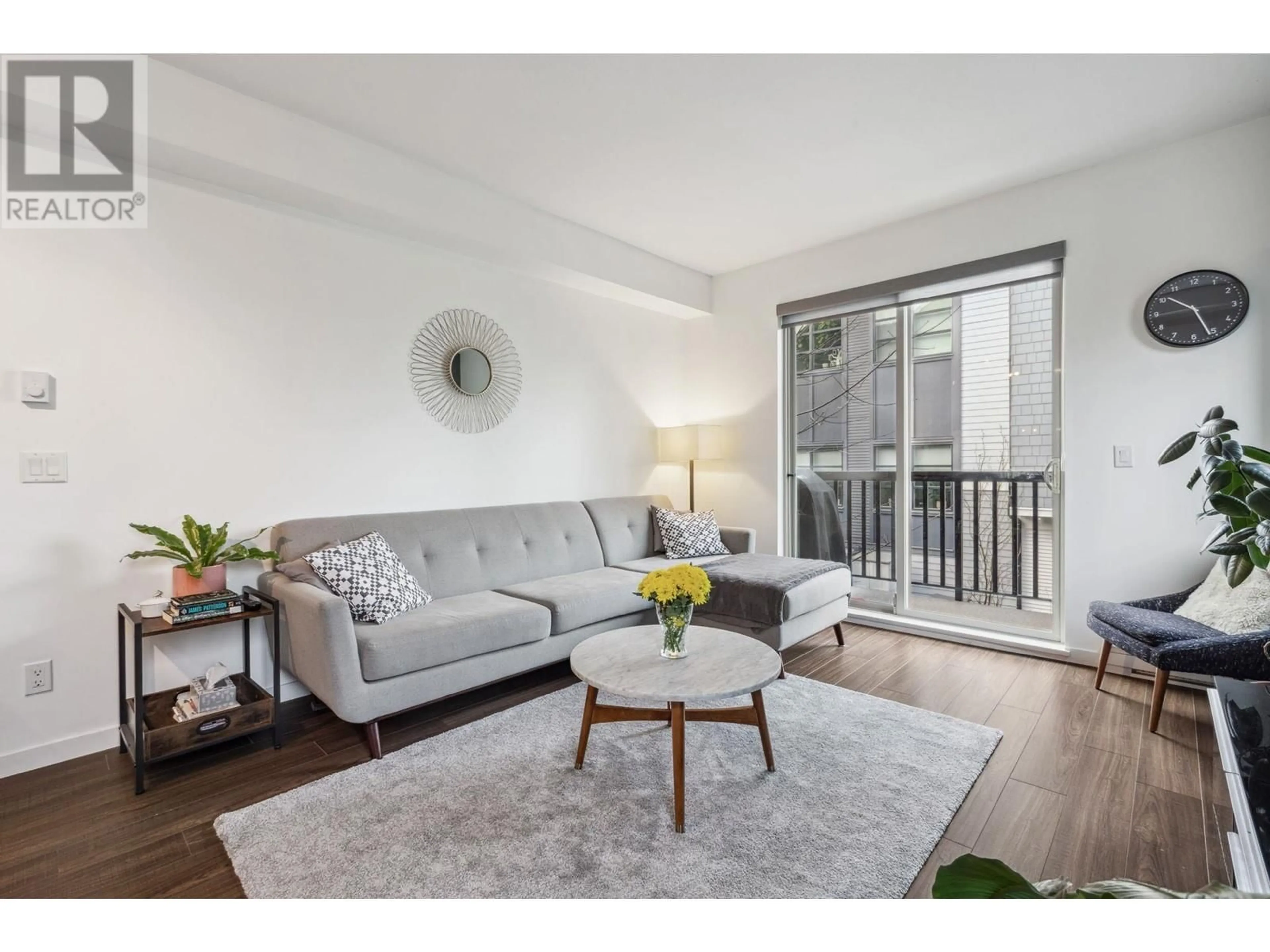 Living room with furniture, wood/laminate floor for 61 433 SEYMOUR RIVER PLACE, North Vancouver British Columbia V7H0B8