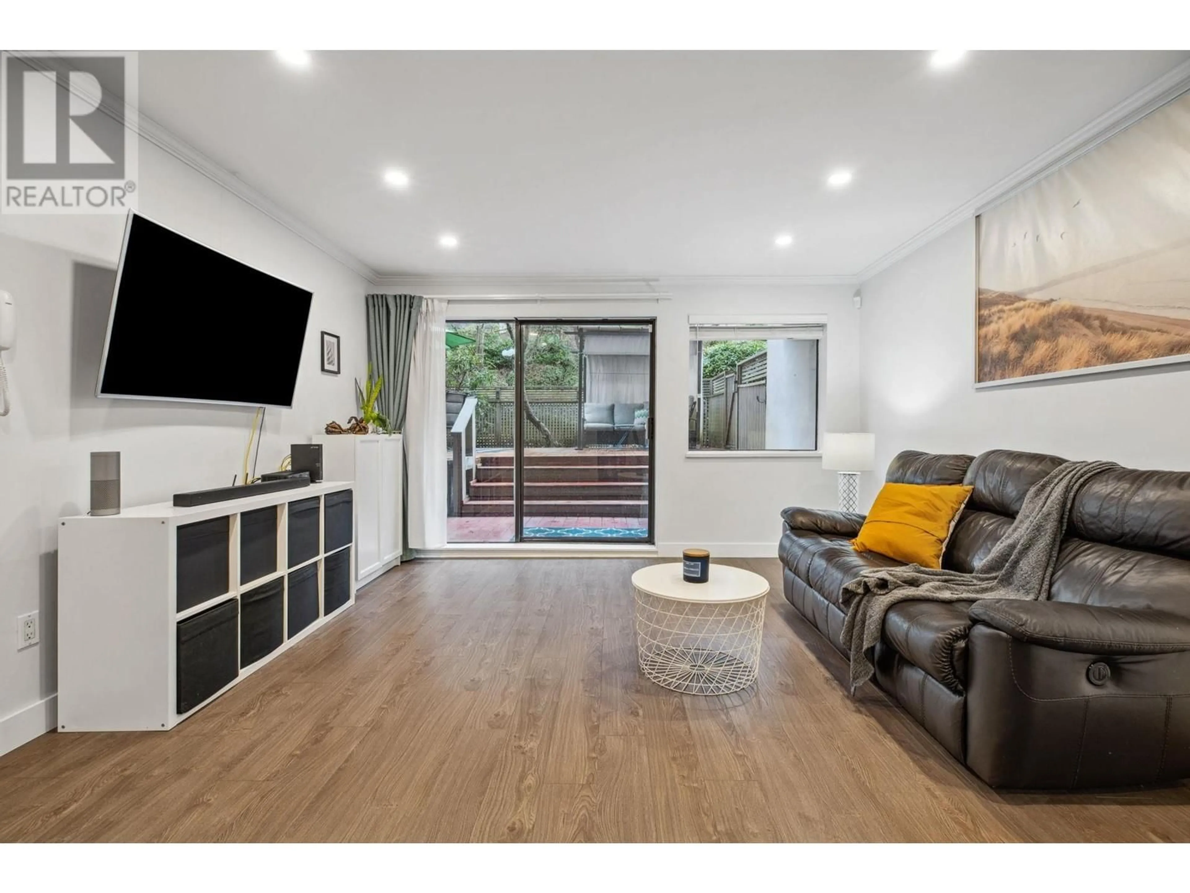 Living room with furniture, wood/laminate floor for 111 1955 WOODWAY PLACE, Burnaby British Columbia V5B4S5