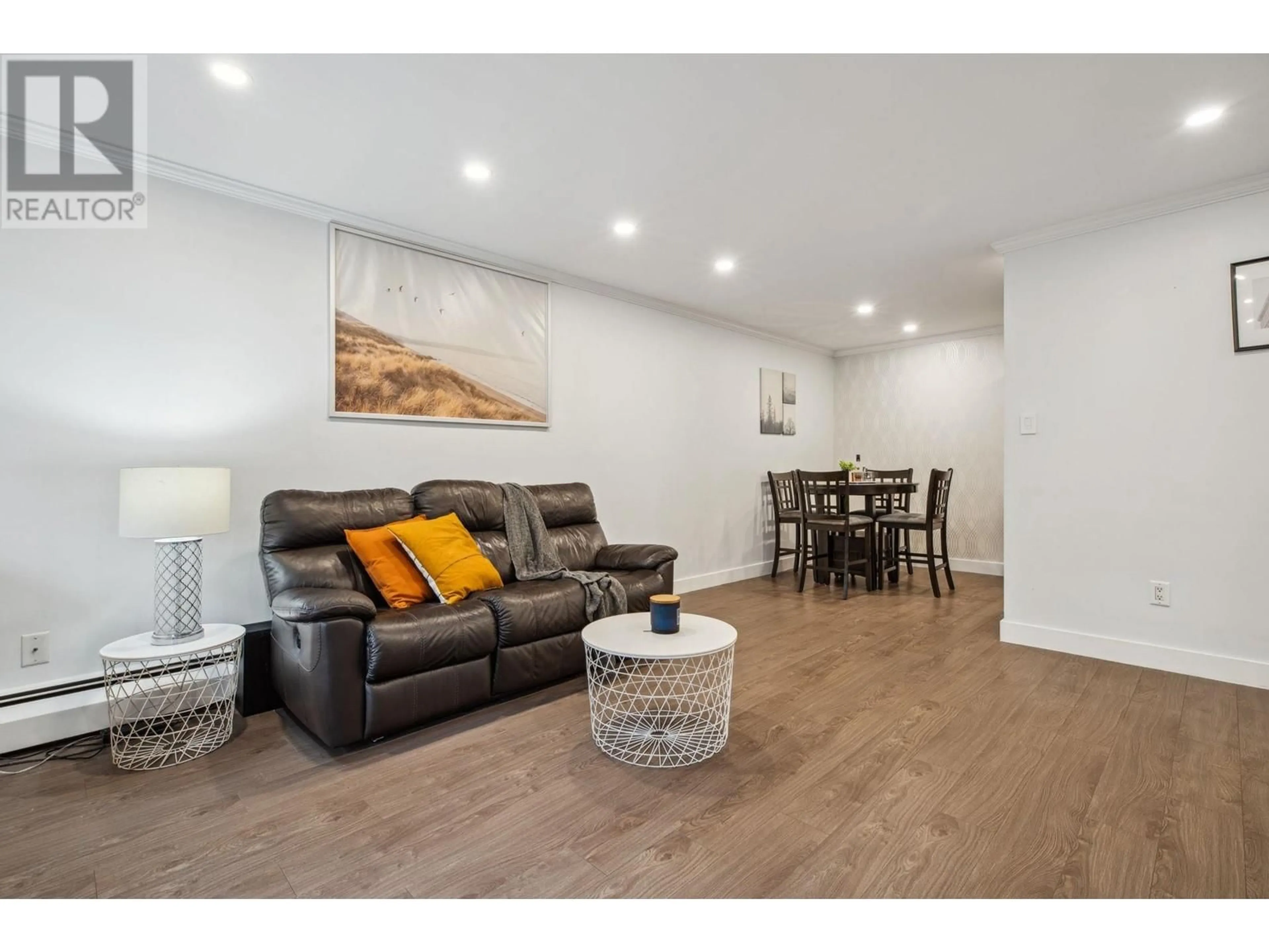 Living room with furniture, wood/laminate floor for 111 1955 WOODWAY PLACE, Burnaby British Columbia V5B4S5