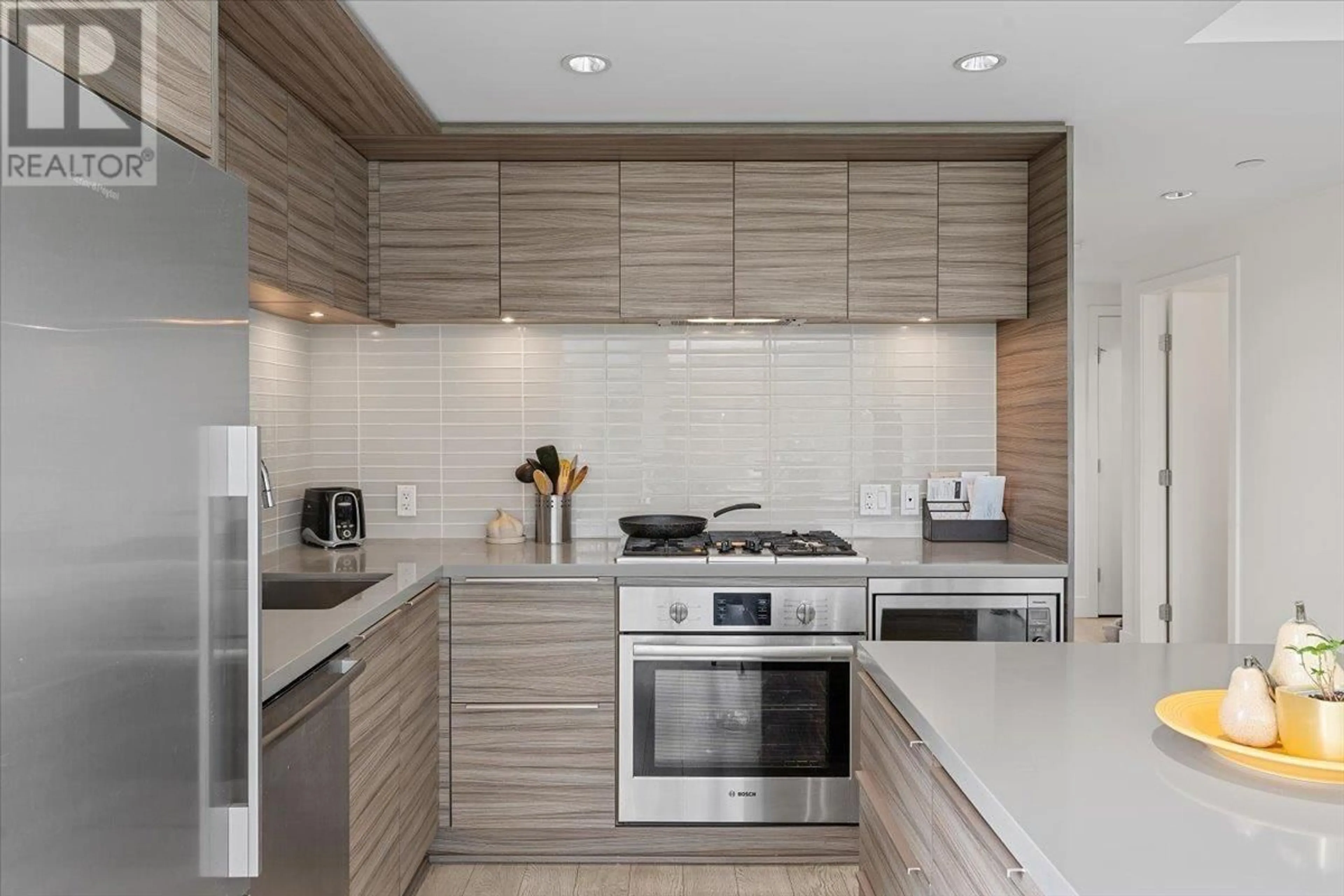 Contemporary kitchen, ceramic/tile floor for 402 1550 FERN STREET, North Vancouver British Columbia V7J0A9