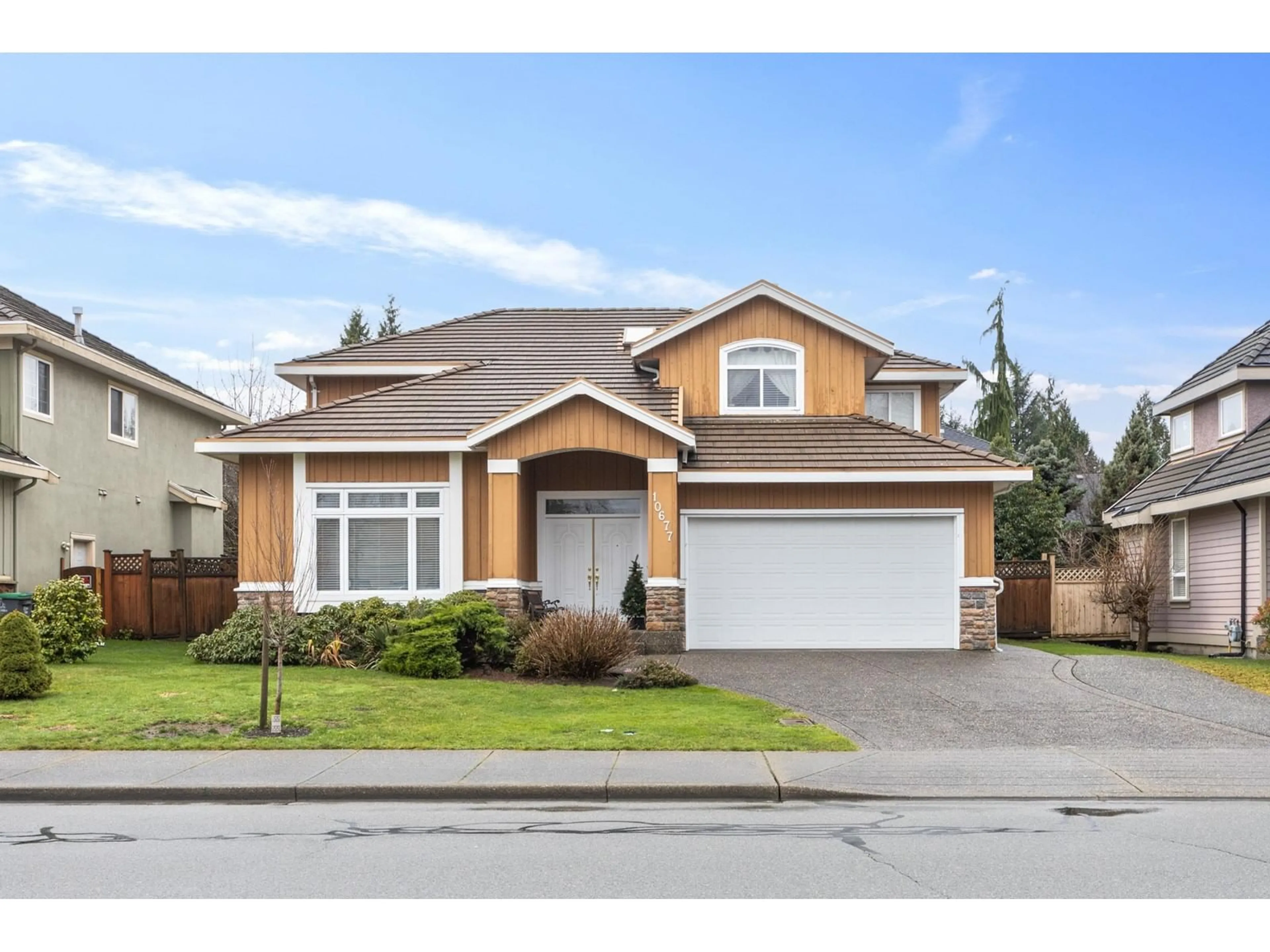 Home with vinyl exterior material, street for 10677 164 STREET, Surrey British Columbia V4N4S2