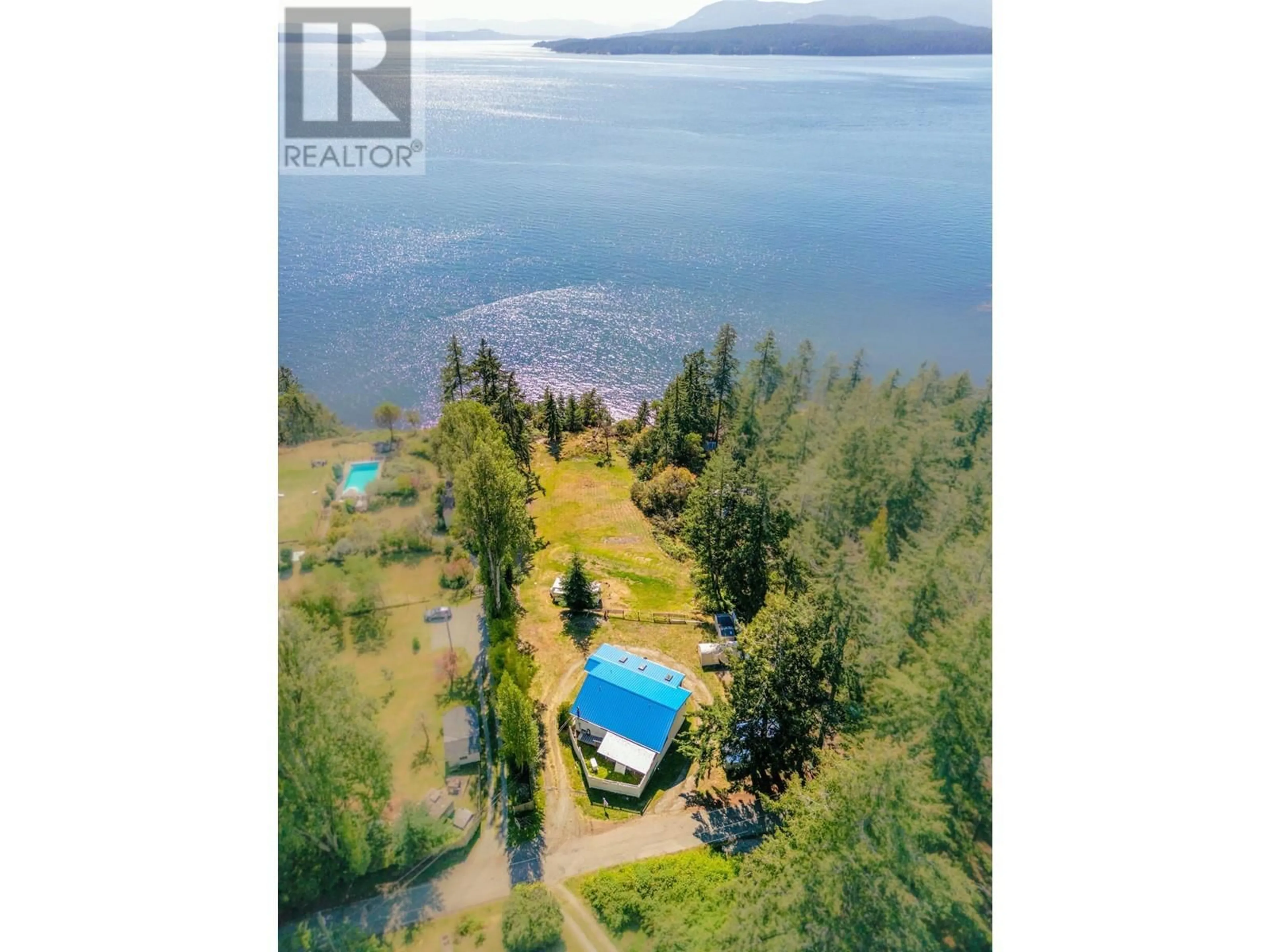 A pic from outside/outdoor area/front of a property/back of a property/a pic from drone, water/lake/river/ocean view for 1325 MACKINNON ROAD, Pender Island British Columbia V0N2M1