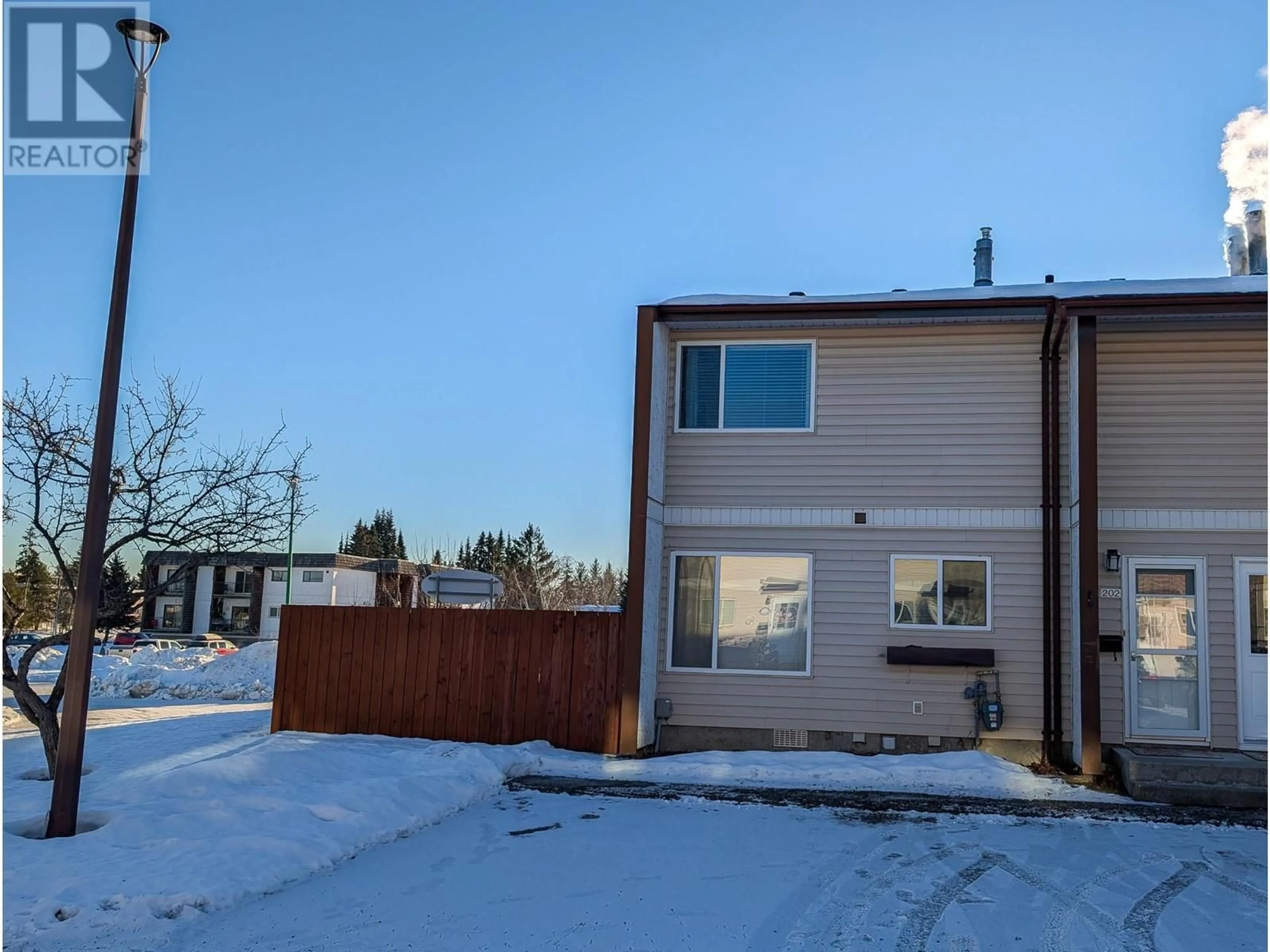 A pic from outside/outdoor area/front of a property/back of a property/a pic from drone, street for 202 4344 JACKPINE AVENUE, Prince George British Columbia V2M6G5