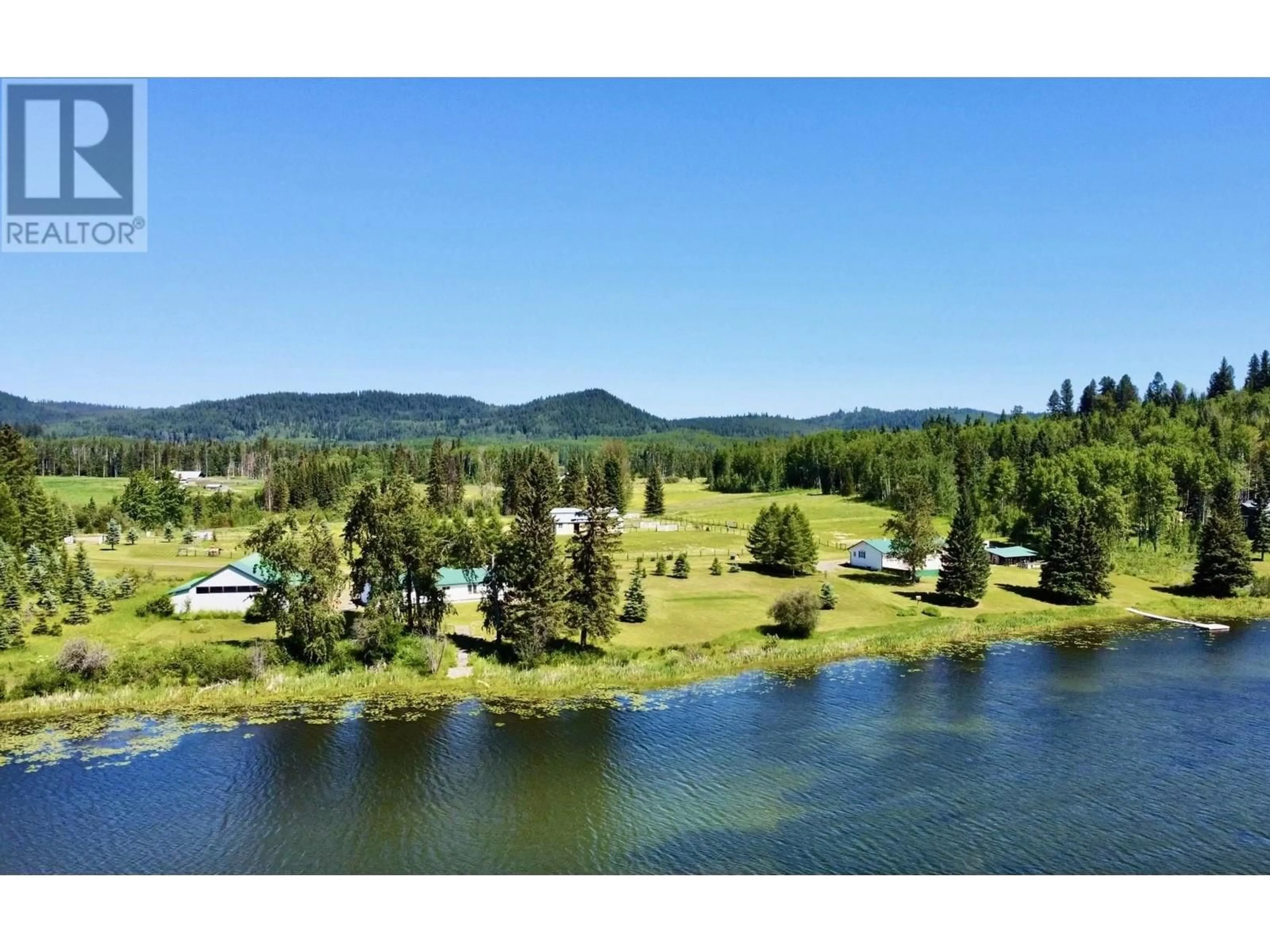 A pic from outside/outdoor area/front of a property/back of a property/a pic from drone, water/lake/river/ocean view for 8320 RAINBOW COUNTRY ROAD, Bridge Lake British Columbia V0K1E0