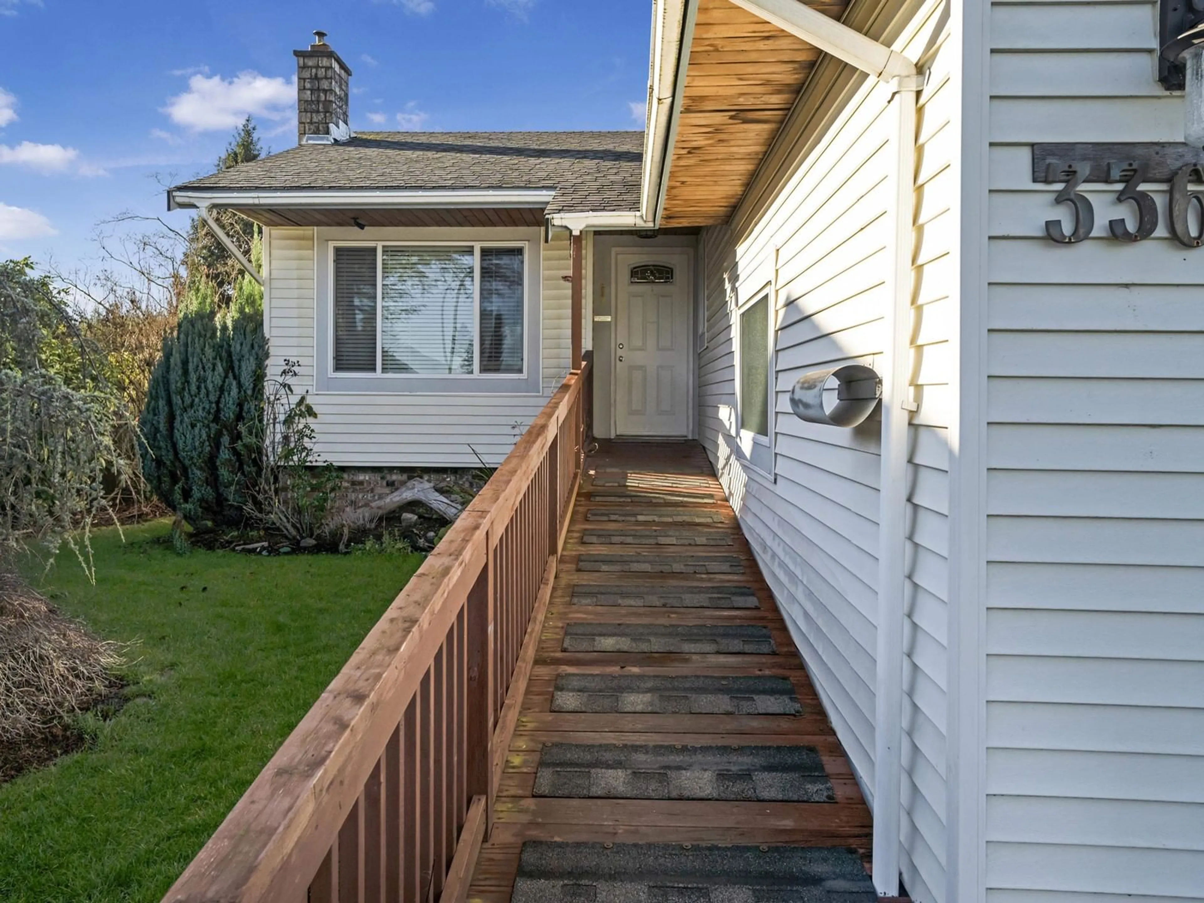 Home with vinyl exterior material, street for 3363 OKANAGAN DRIVE, Abbotsford British Columbia V2T4Z2