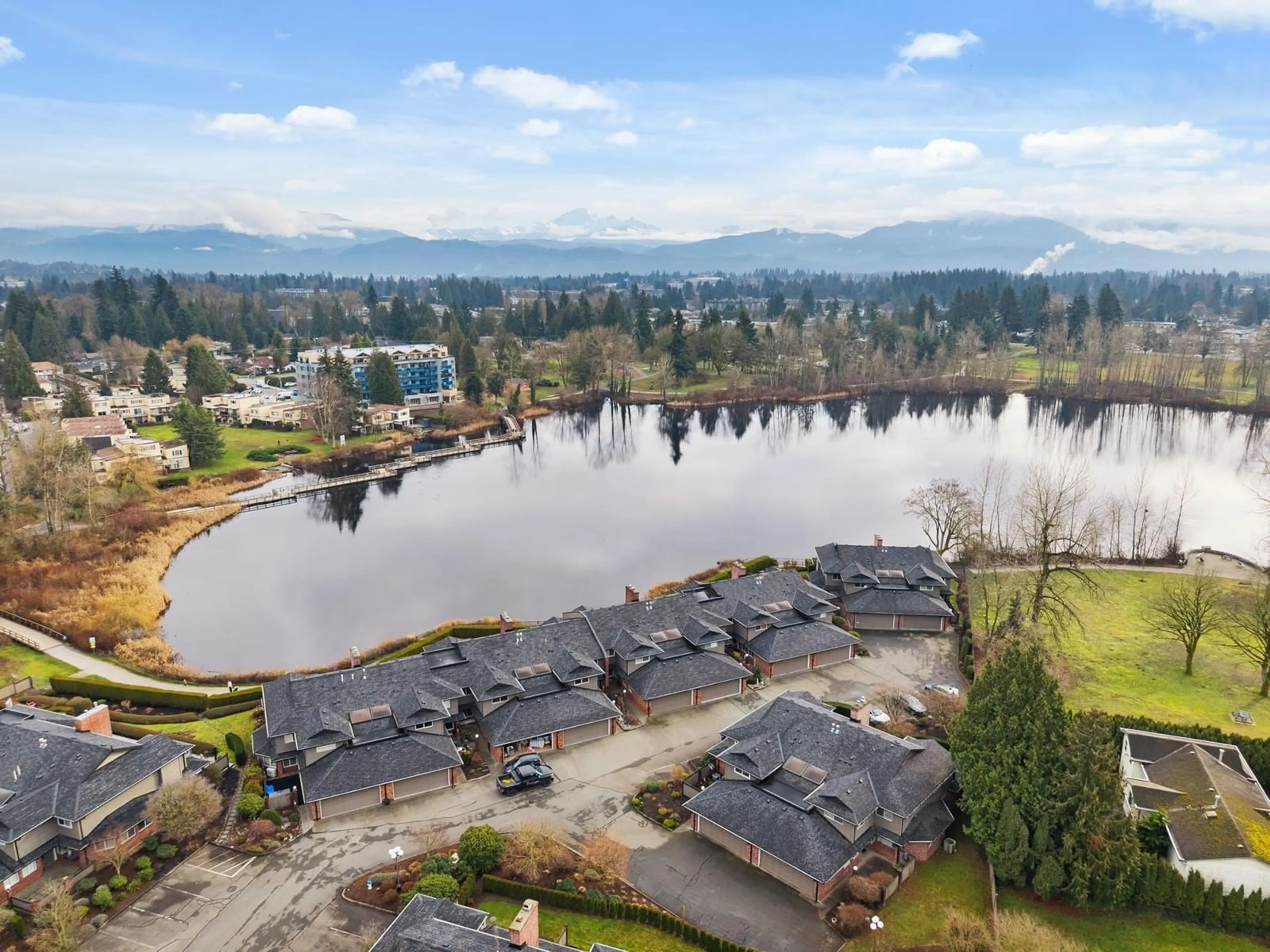 A pic from outside/outdoor area/front of a property/back of a property/a pic from drone, water/lake/river/ocean view for 12 33000 MILL LAKE ROAD, Abbotsford British Columbia V2S2A3