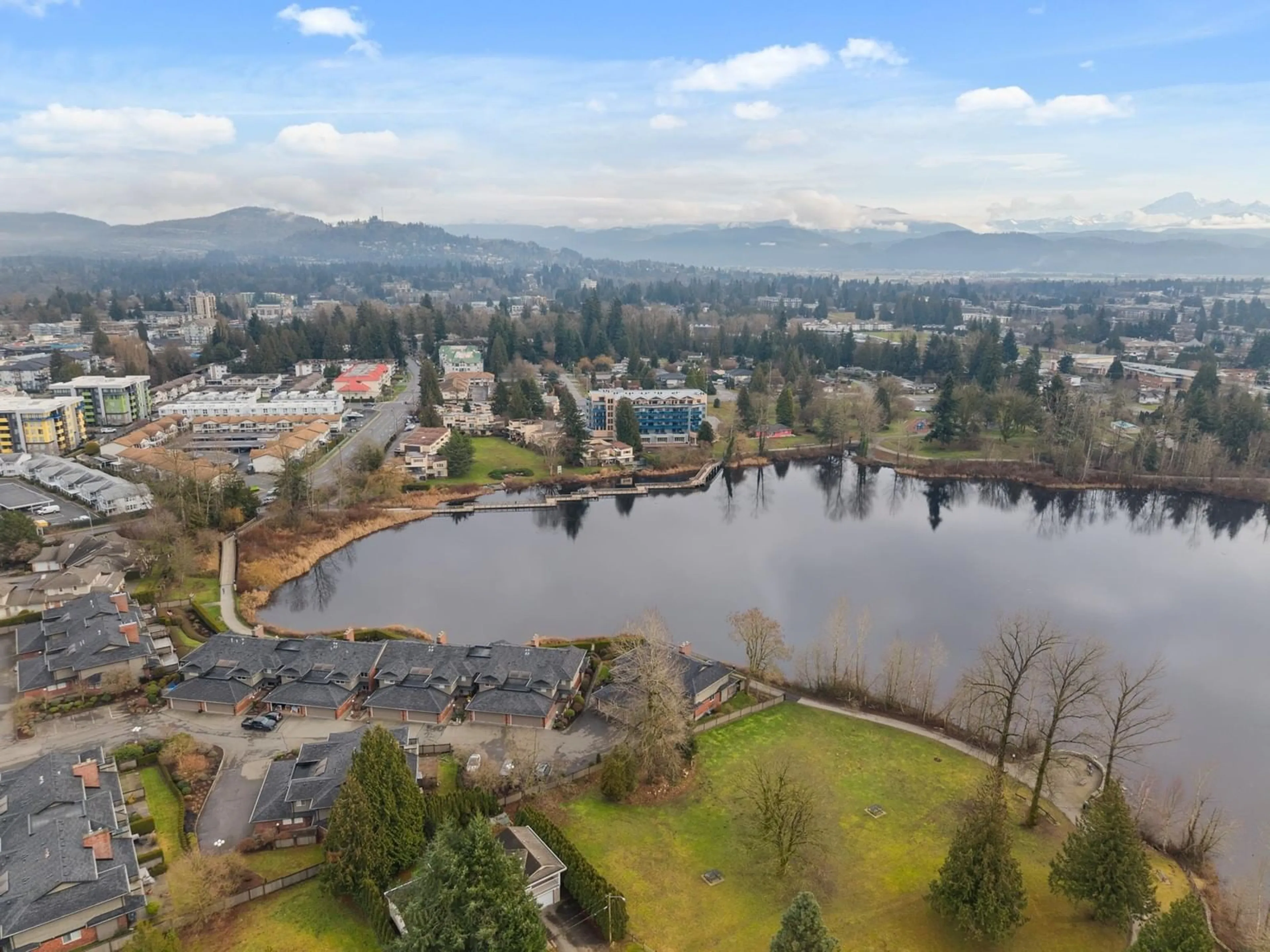 A pic from outside/outdoor area/front of a property/back of a property/a pic from drone, water/lake/river/ocean view for 12 33000 MILL LAKE ROAD, Abbotsford British Columbia V2S2A3