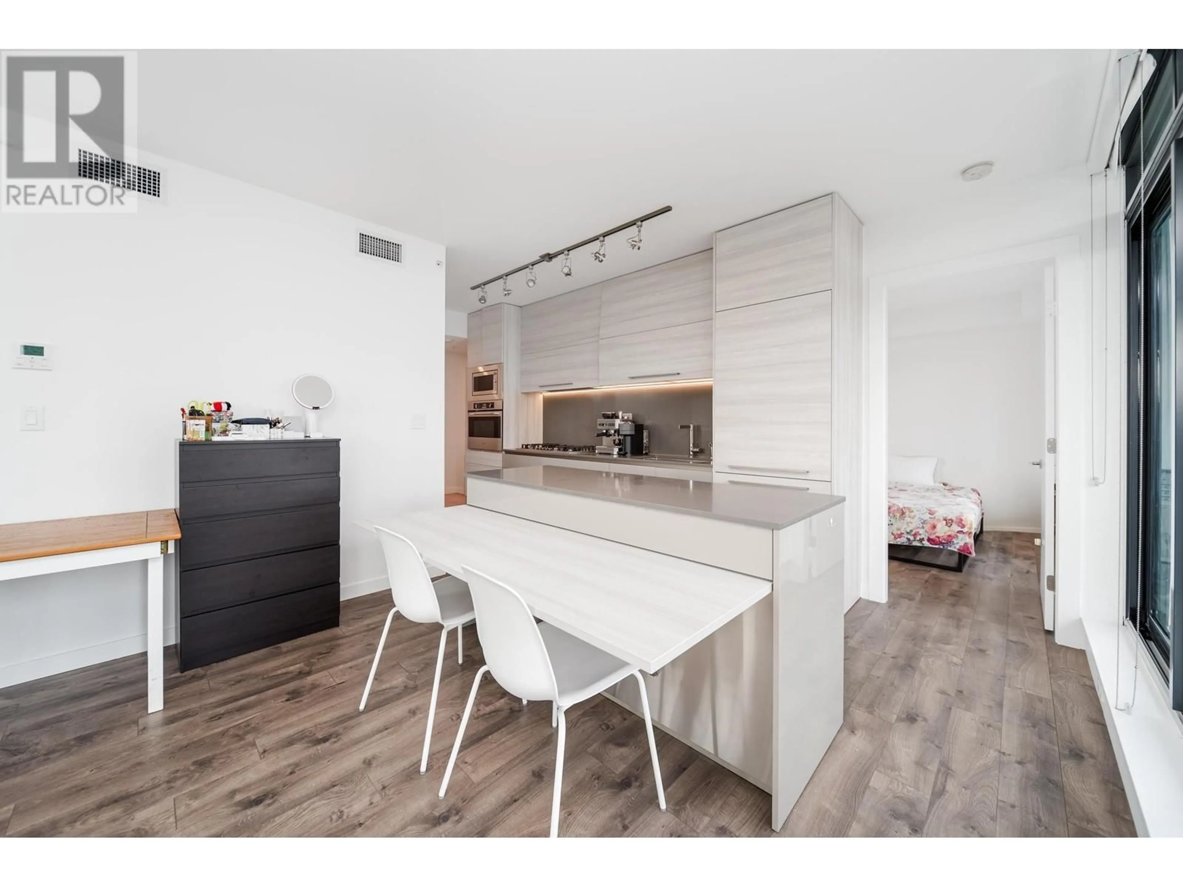 Open concept kitchen, wood/laminate floor for 606 4488 JUNEAU STREET, Burnaby British Columbia V5C0M4