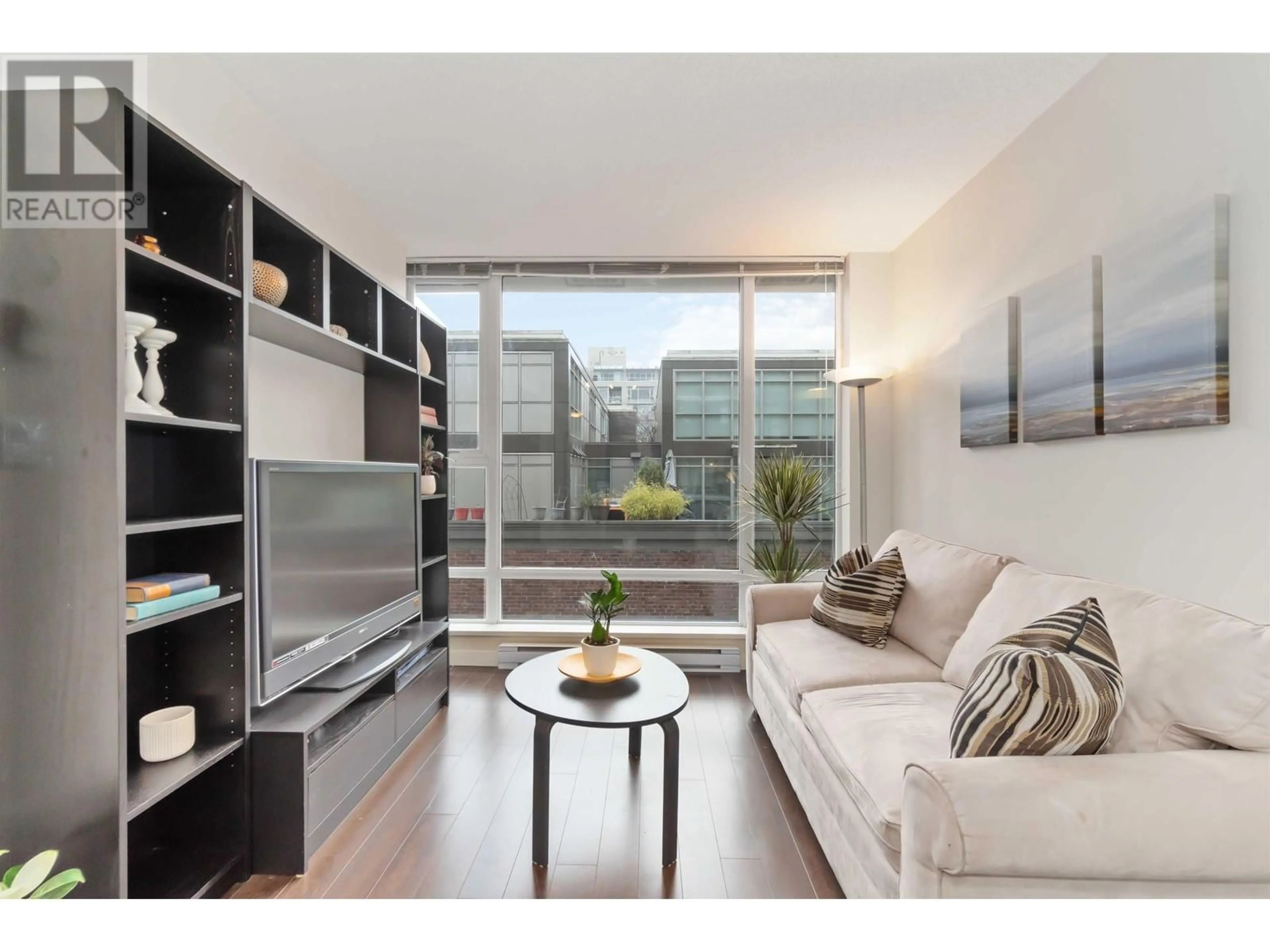 Living room with furniture, wood/laminate floor for 512 1919 WYLIE STREET, Vancouver British Columbia V5Y0E7