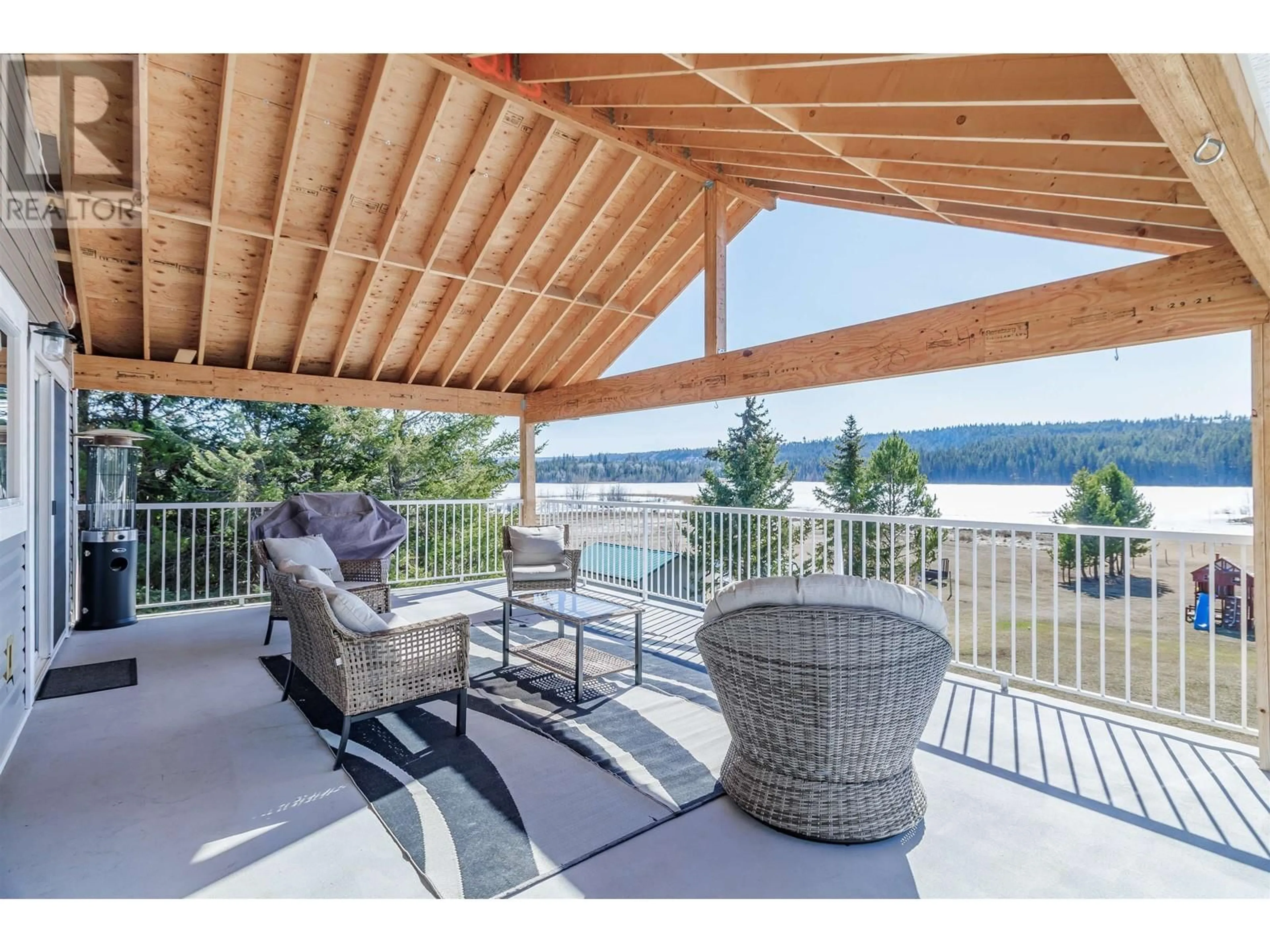 Patio, water/lake/river/ocean view for 5588 LAKESIDE COURT, 103 Mile House British Columbia V0K2E1
