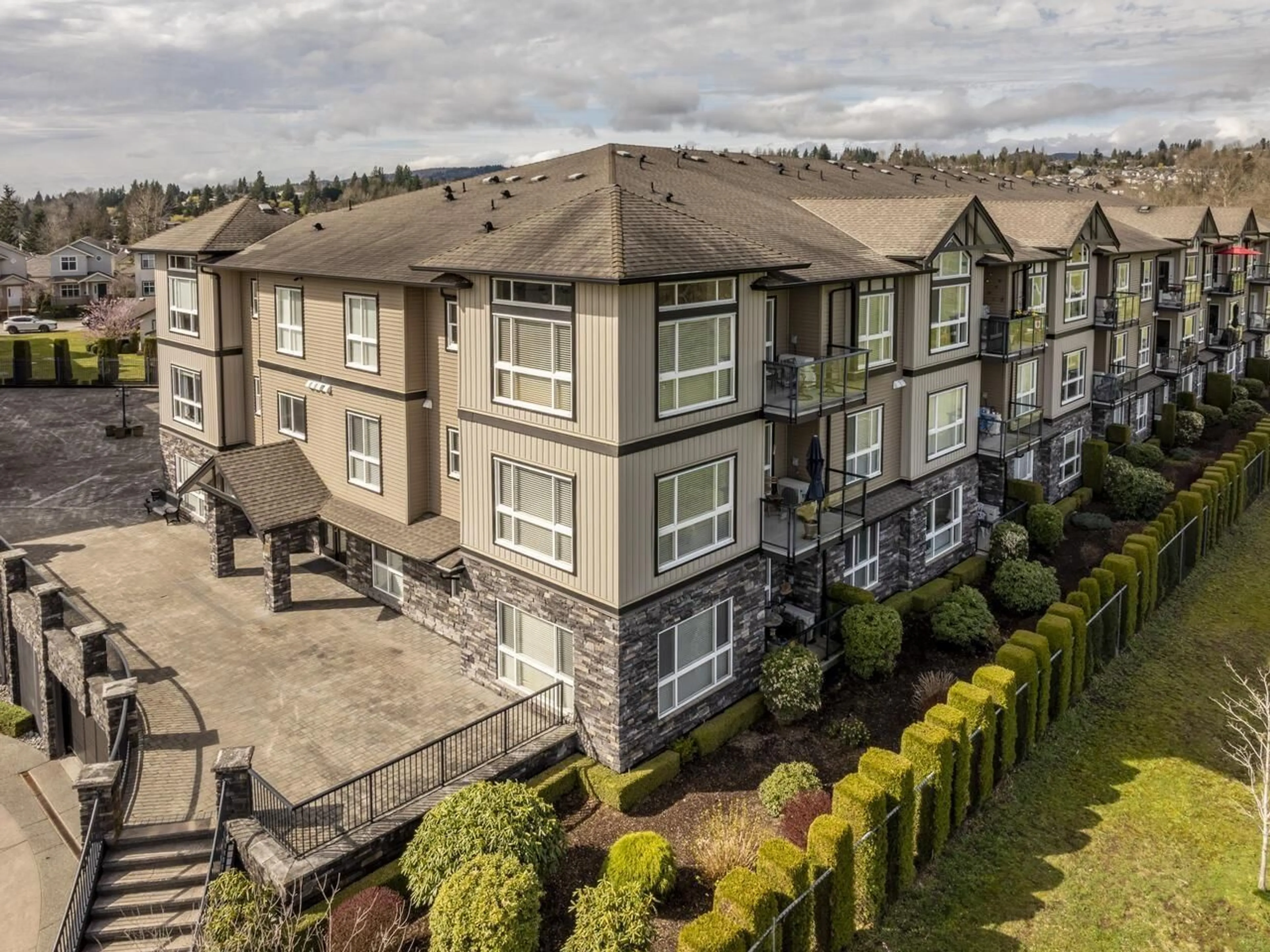 A pic from outside/outdoor area/front of a property/back of a property/a pic from drone, mountain view for B303 - 33755 7TH, Mission British Columbia V2V0A4