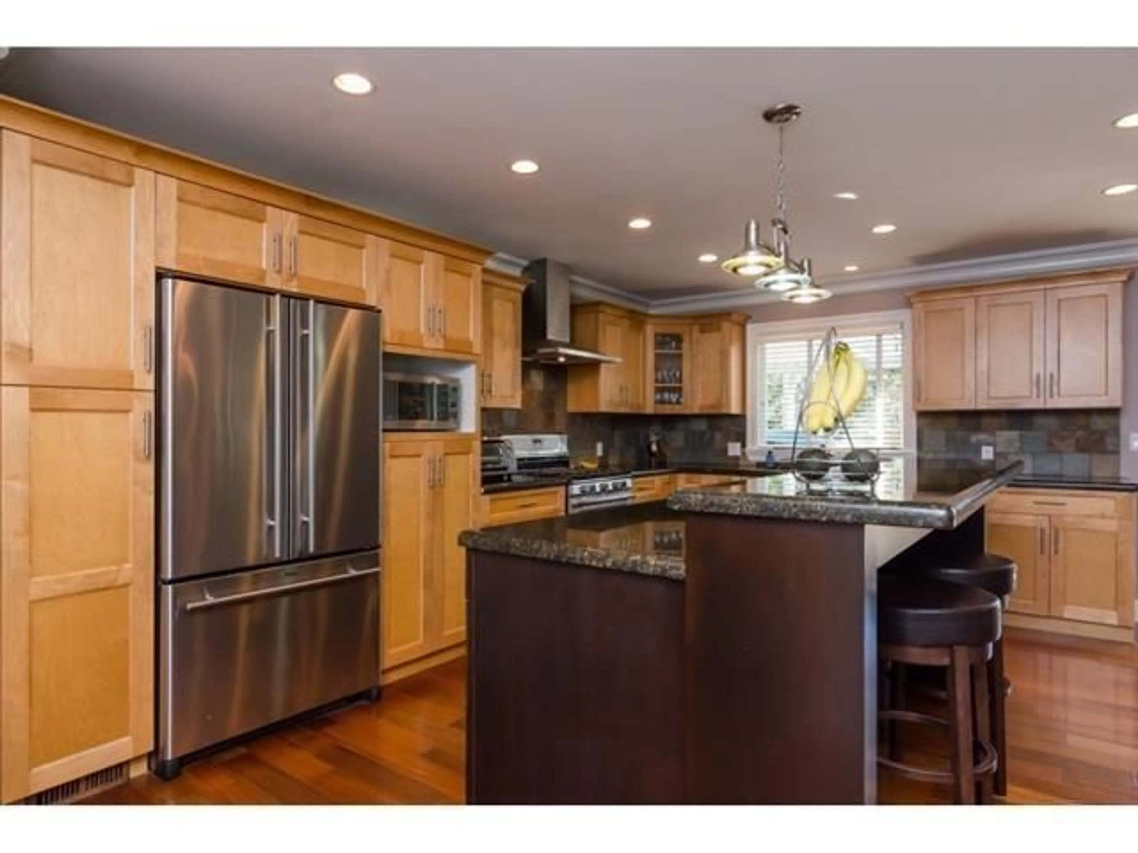 Open concept kitchen, wood/laminate floor for 17570 92 AVENUE, Surrey British Columbia V4N3G3