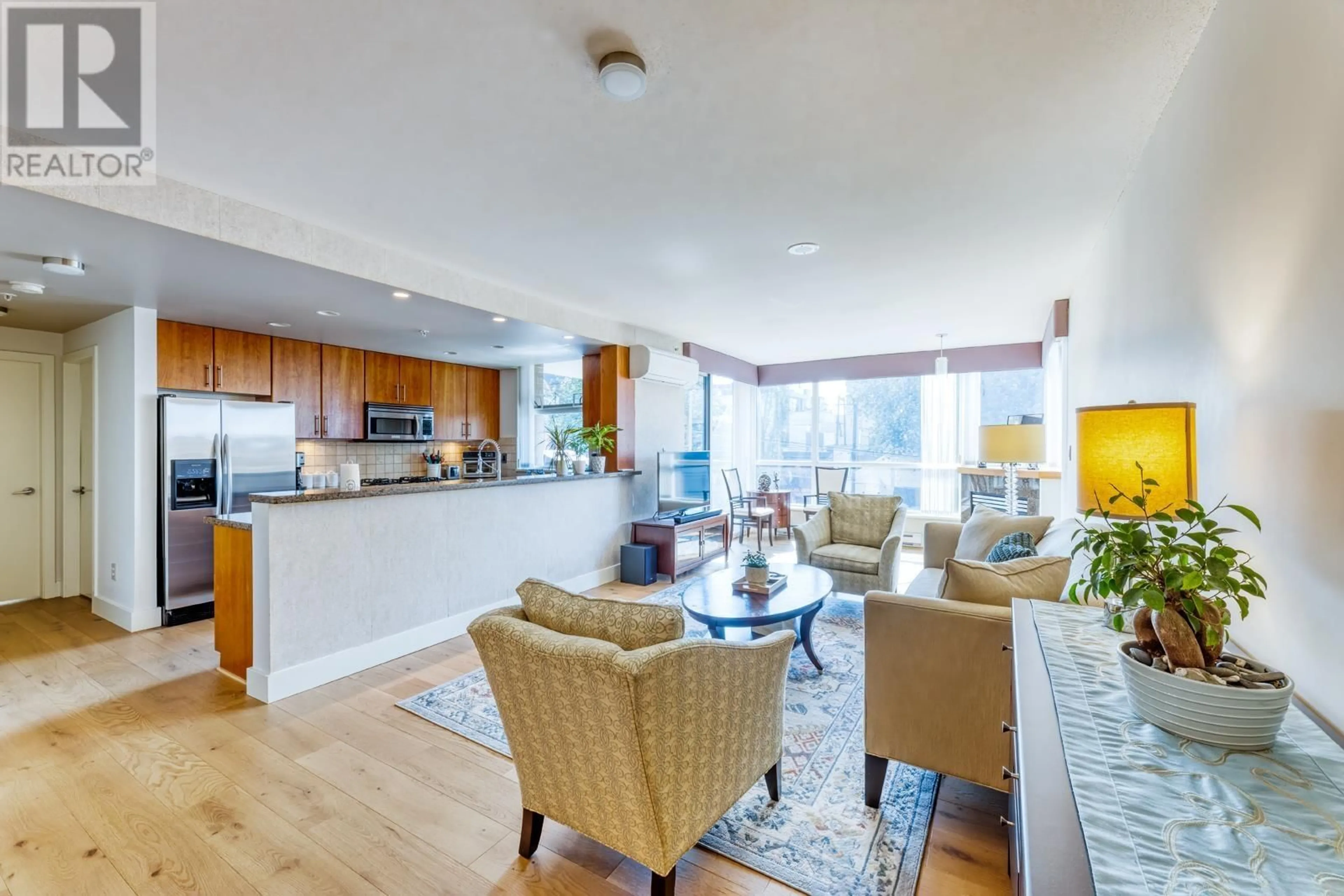 Living room with furniture, wood/laminate floor for 307 1450 W 6TH AVENUE, Vancouver British Columbia V6H4H9