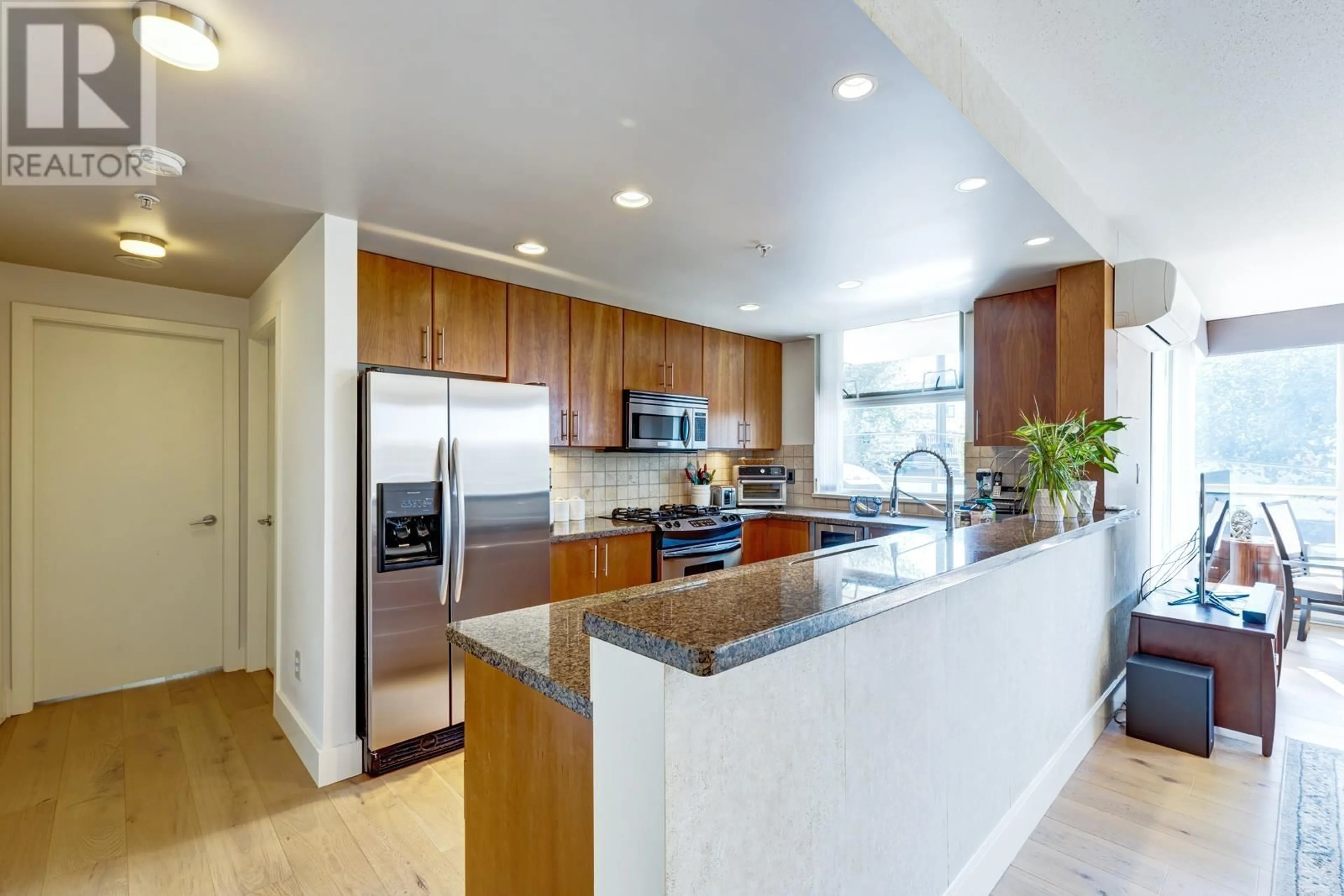 Open concept kitchen, ceramic/tile floor for 307 1450 W 6TH AVENUE, Vancouver British Columbia V6H4H9