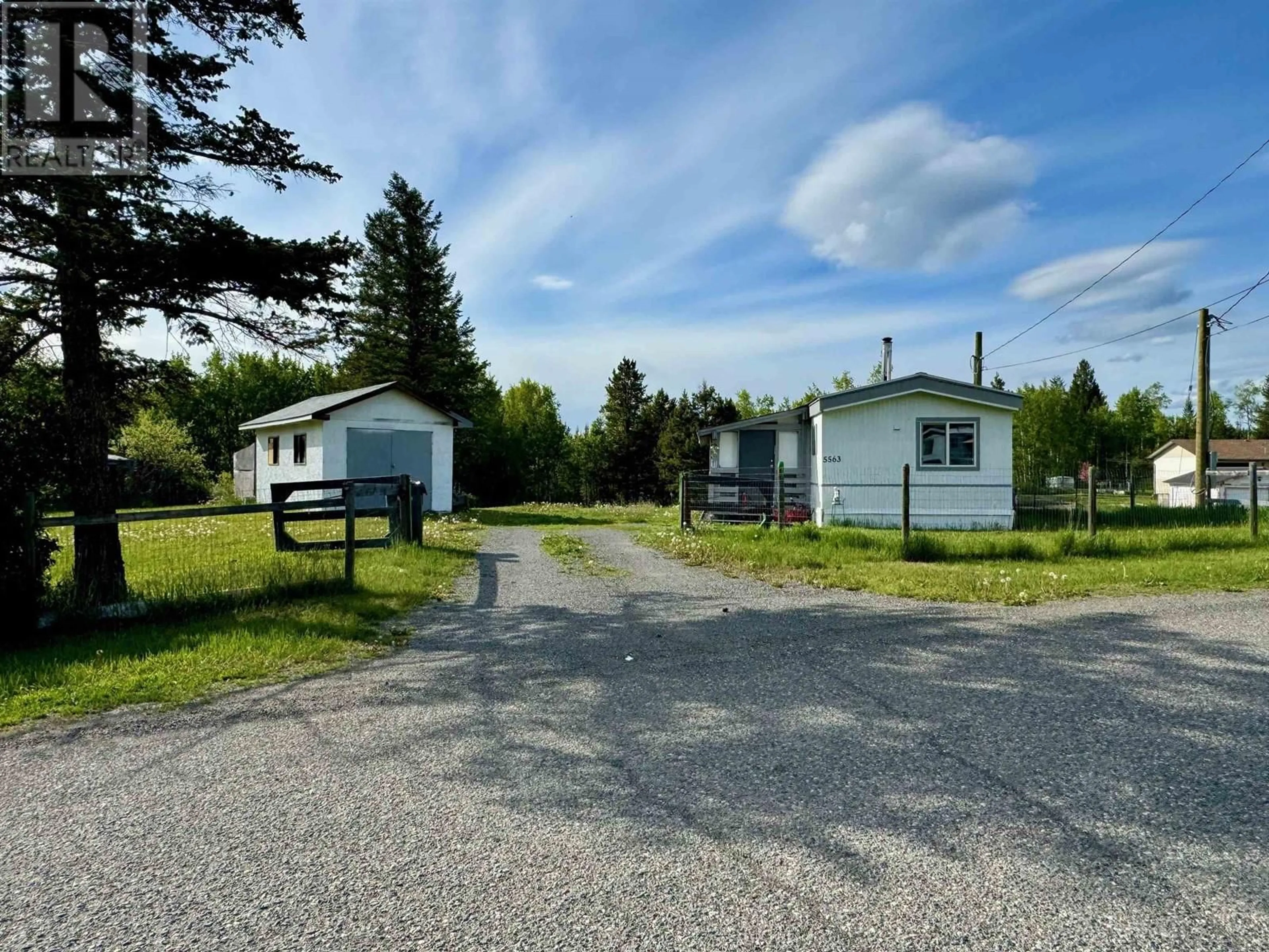 A pic from outside/outdoor area/front of a property/back of a property/a pic from drone, street for 5563 103 MILE LAKE ROAD, 103 Mile House British Columbia V0K2E1