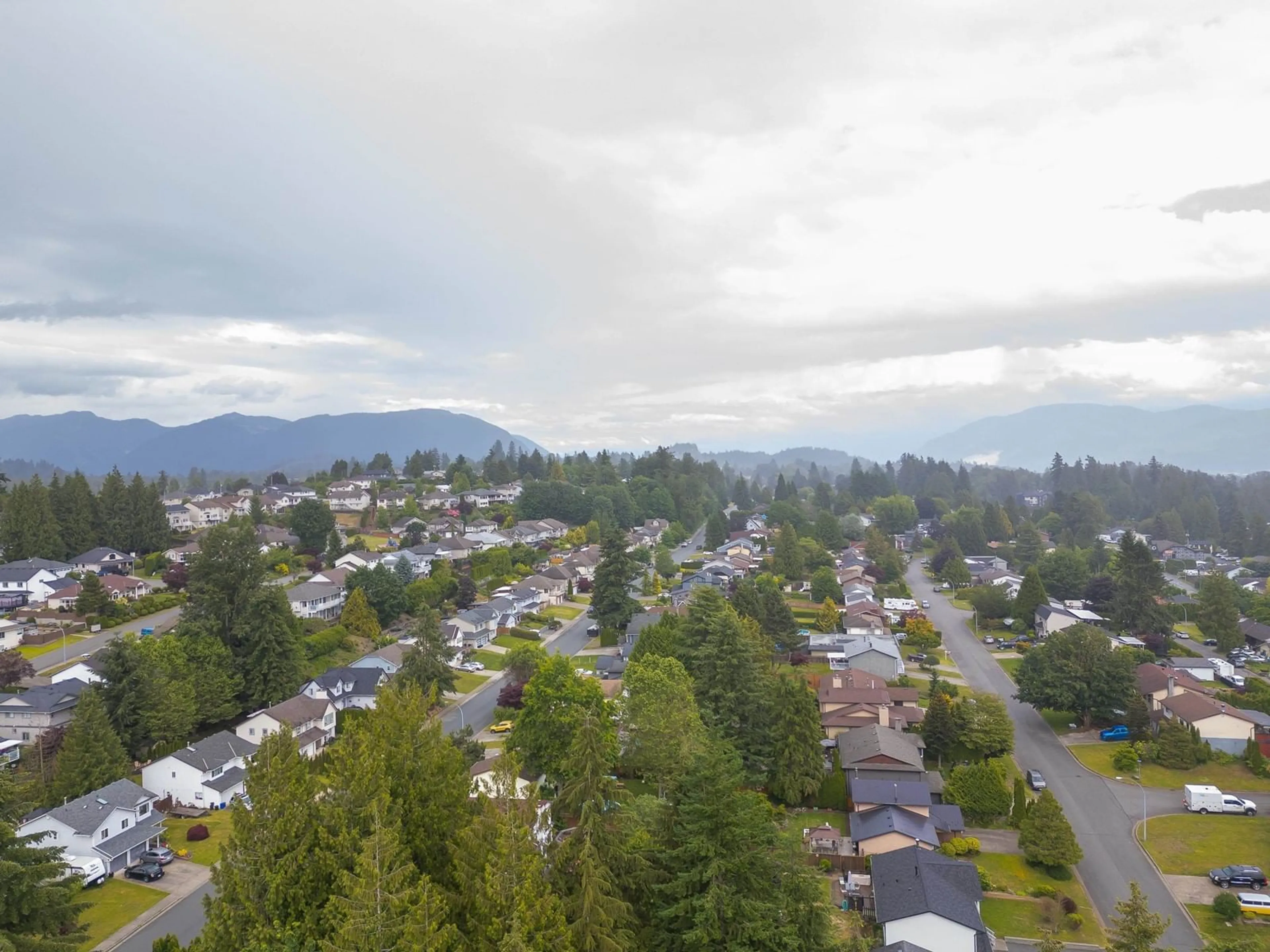 A pic from outside/outdoor area/front of a property/back of a property/a pic from drone, mountain view for 8061 CARIBOU STREET, Mission British Columbia V2V5R1