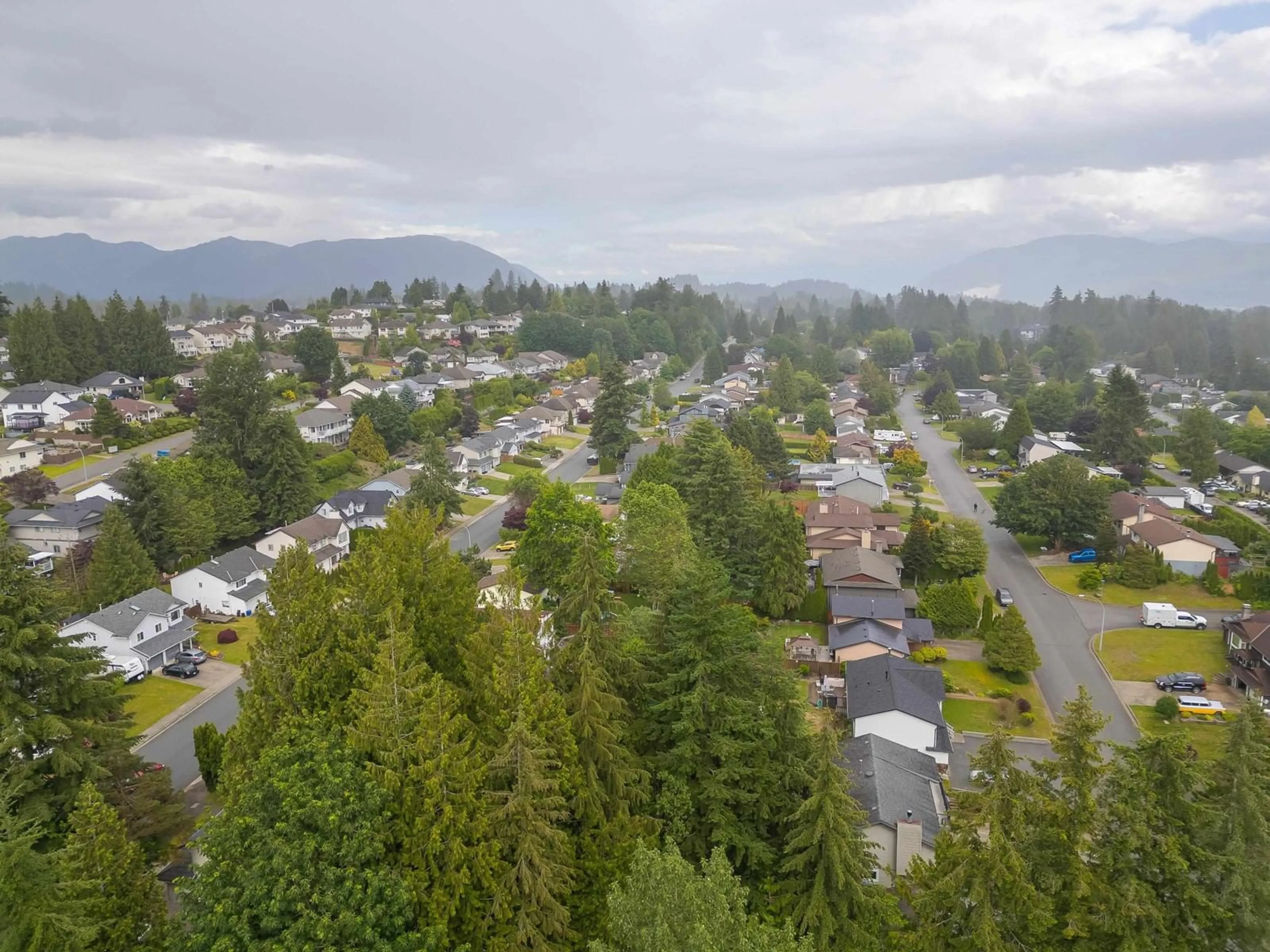 A pic from outside/outdoor area/front of a property/back of a property/a pic from drone, mountain view for 8061 CARIBOU STREET, Mission British Columbia V2V5R1